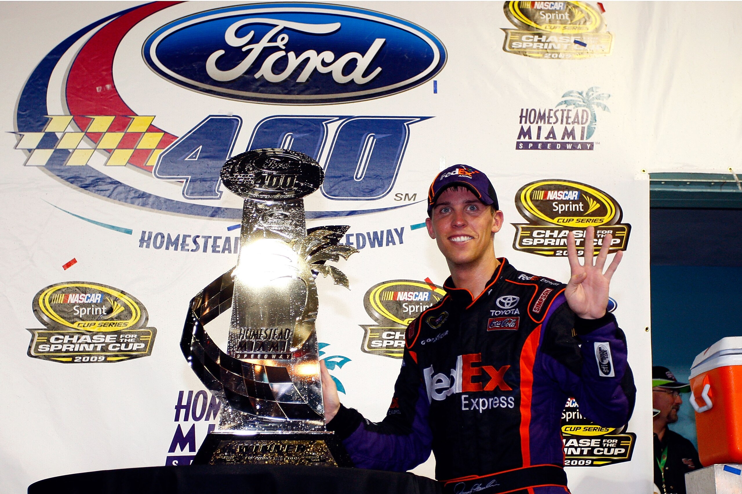 HOMESTEAD, FL - NOVEMBER 22: Denny Hamlin, driver of the #11 FedEx Express Toyota, celebrates in victory lane after winning the NASCAR Sprint Cup Series Ford 400 at Homestead-Miami Speedway on November 22, 2009 in Homestead, Florida. (Photo by Geoff Bur HOMESTEAD, FL - NOVEMBER 22: Denny Hamlin, driver of the #11 FedEx Express Toyota, celebrates in victory lane after winning the NASCAR Sprint Cup Series Ford 400 at Homestead-Miami Speedway on November 22, 2009 in Homestead, Florida. (Photo by Geoff Bur