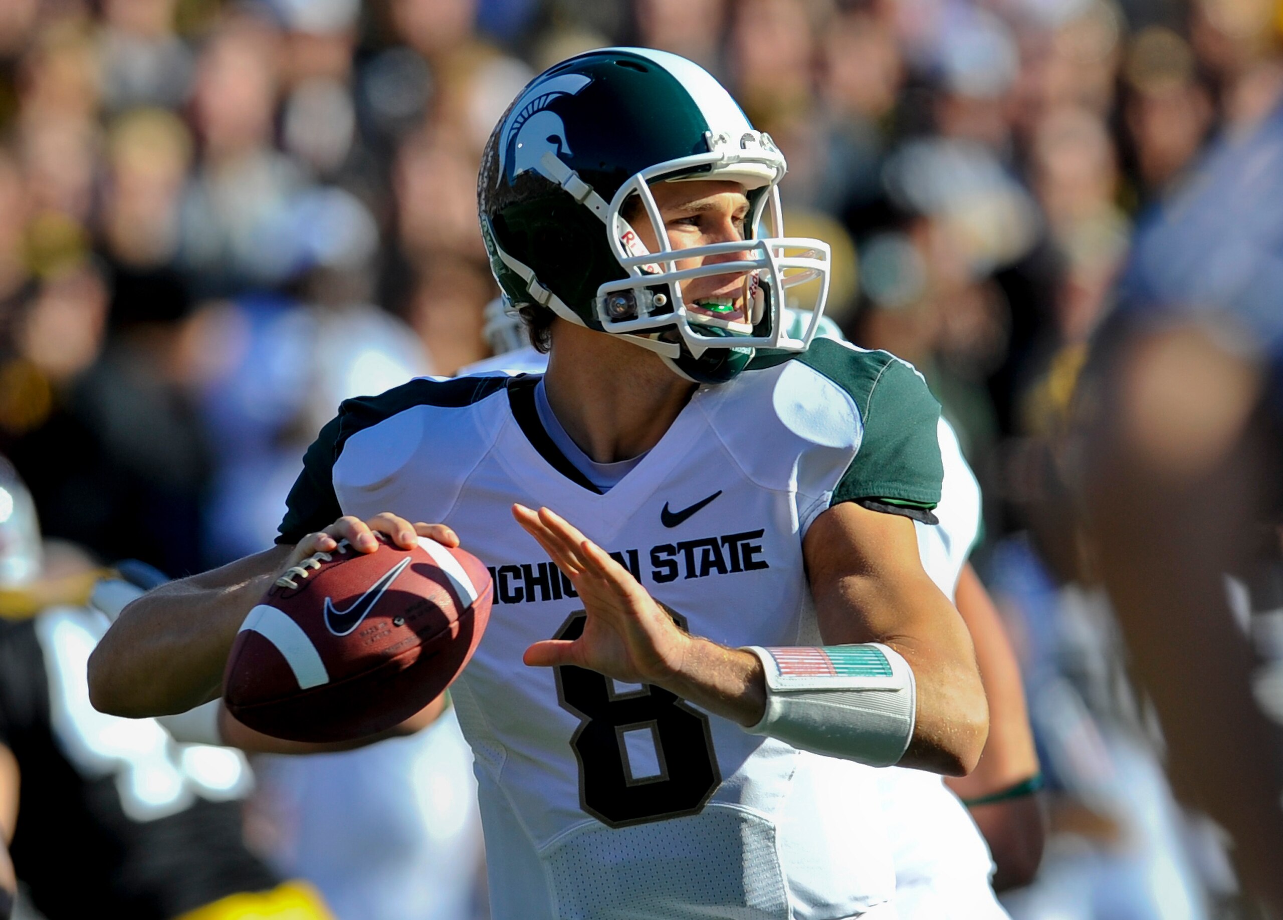 IOWA CITY, IA - OCTOBER 30- Quarterback Kirk Cousins #8 of the Michigan State Spartans looks down field for a receiver during play against the University of Iowa Hawkeyes at Kinnick Stadium on October 30, 2010 in Iowa City, Iowa. Iowa won 37-6 over Michig IOWA CITY, IA - OCTOBER 30- Quarterback Kirk Cousins #8 of the Michigan State Spartans looks down field for a receiver during play against the University of Iowa Hawkeyes at Kinnick Stadium on October 30, 2010 in Iowa City, Iowa. Iowa won 37-6 over Michig