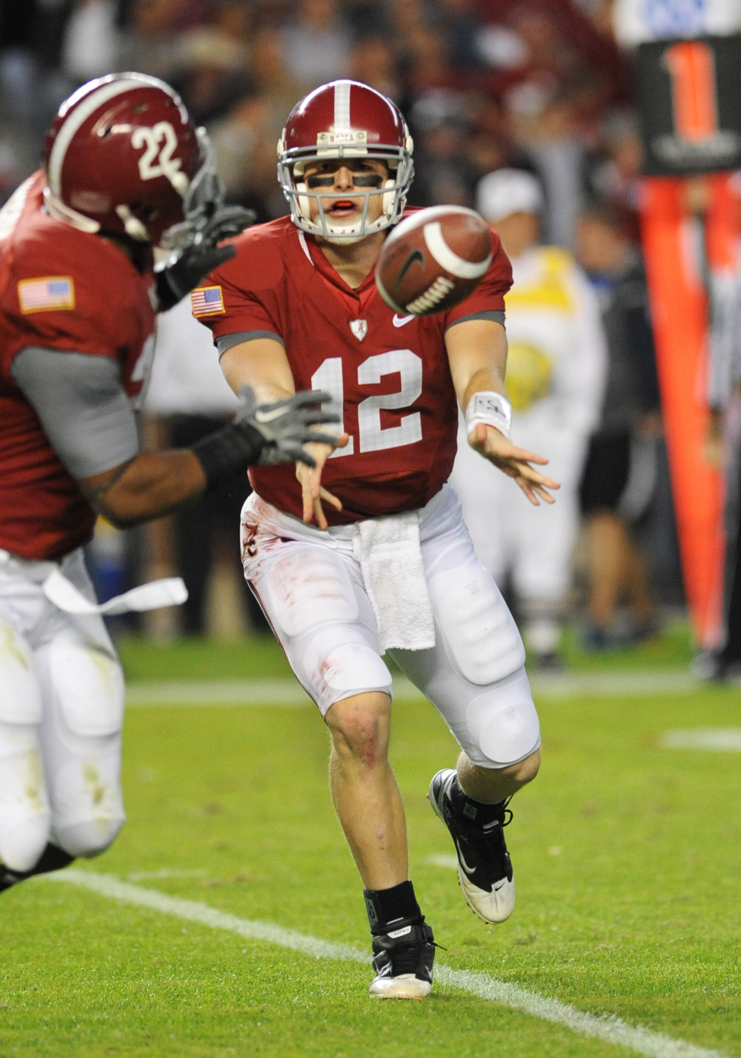 TUSCALOOSA, AL - NOVEMBER 13: Quarterback Greg McElroy #12 of the Alabama Crimson Tide laterals against the Mississippi State Bulldogs November 13, 2010 at Bryant-Denny Stadium in Tuscaloosa, Alabama. (Photo by Al Messerschmidt/Getty Images) TUSCALOOSA, AL - NOVEMBER 13: Quarterback Greg McElroy #12 of the Alabama Crimson Tide laterals against the Mississippi State Bulldogs November 13, 2010 at Bryant-Denny Stadium in Tuscaloosa, Alabama. (Photo by Al Messerschmidt/Getty Images)