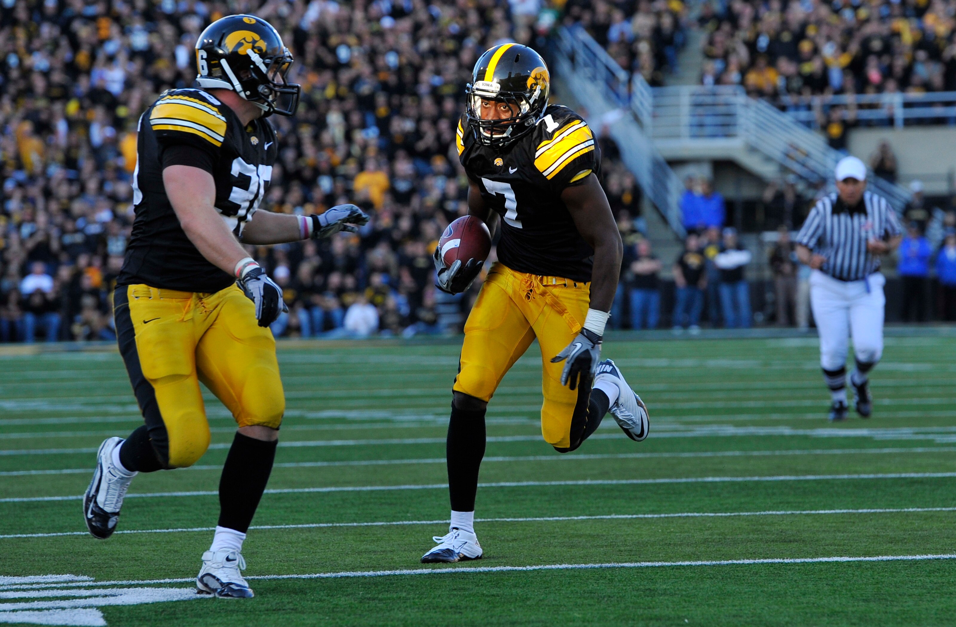 IOWA CITY, IA - OCTOBER 30- Wide receiver Marvin McNutt #7 of the University of Iowa Hawkeyes drives the ball into the end zone for a touch down during the second half of play against the Michigan State Spartans at Kinnick Stadium on October 30, 2010 in I