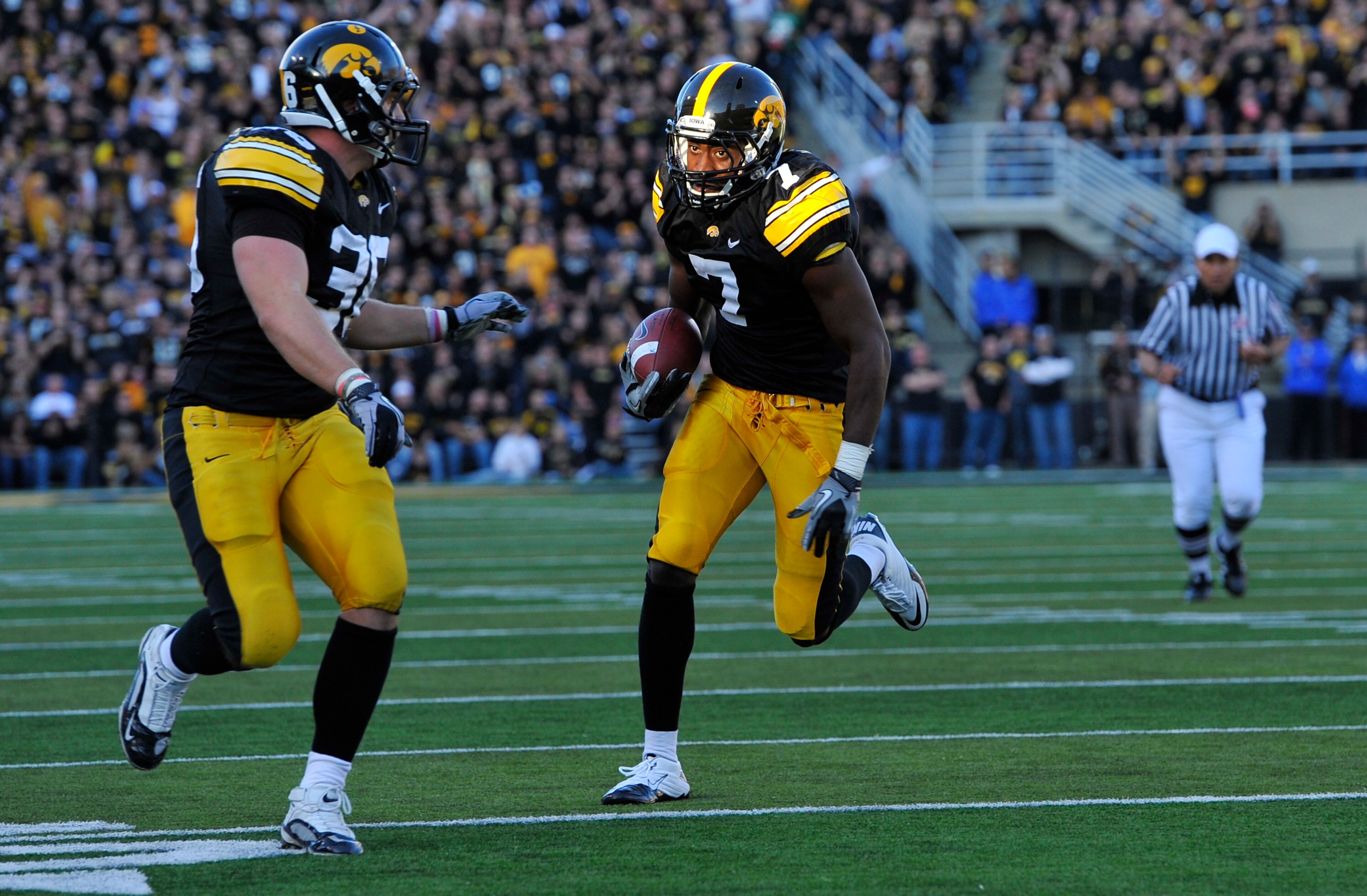 IOWA CITY, IA - OCTOBER 30- Wide receiver Marvin McNutt #7 of the University of Iowa Hawkeyes drives the ball into the end zone for a touch down during the second half of play against the Michigan State Spartans at Kinnick Stadium on October 30, 2010 in I
