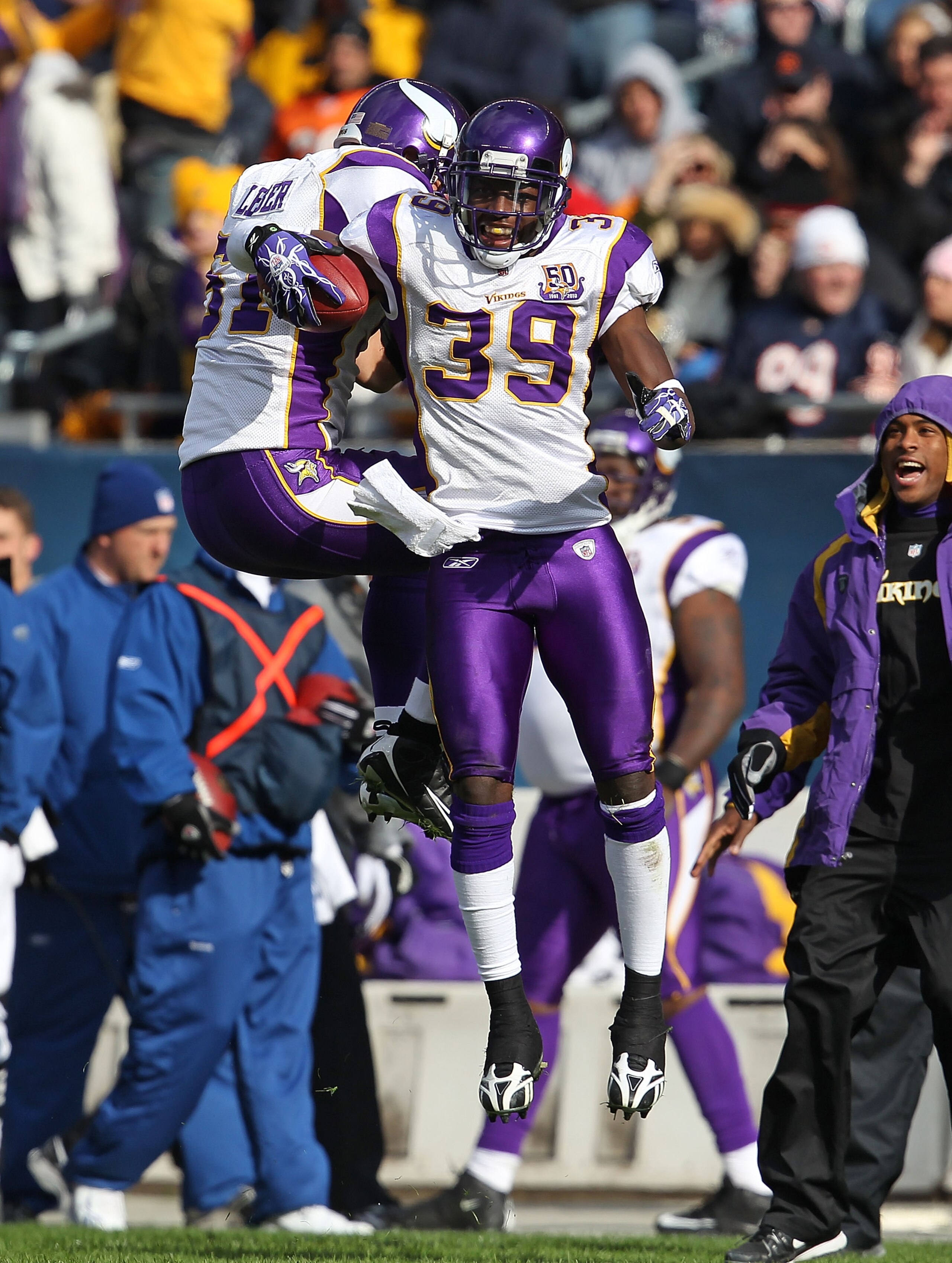 CHICAGO - NOVEMBER 14: Husain Abdullah #39 and Ben Leber #51 of the Minnesota Vikings leap in celebration after a turn-over against the Chicago Bears at Soldier Field on November 14, 2010 in Chicago, Illinois. The Bears defeated the Vikings 27-13. (Photo 