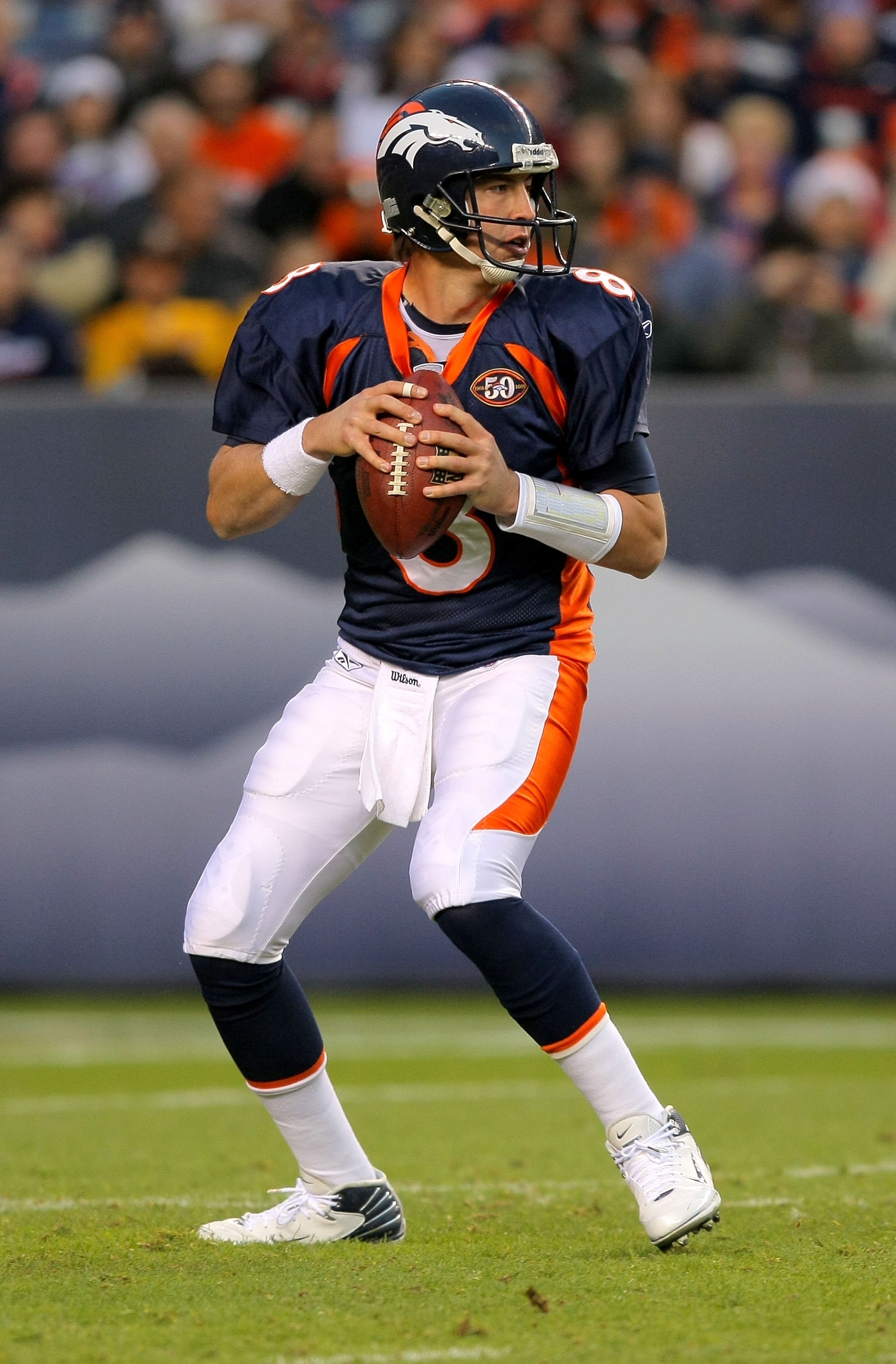 DENVER - NOVEMBER 22:  Quarterback Kyle Orton #8 of the Denver Broncos looks to deliver a pass against the San Diego Chargers during NFL action at Invesco Field at Mile High on November 22, 2009 in Denver, Colorado. The Chargers defeated the Broncos 32-3.