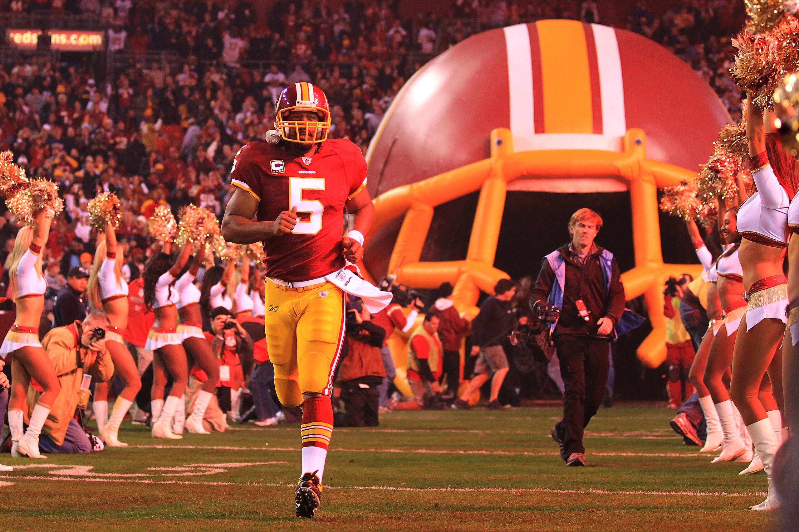 LANDOVER, MD - NOVEMBER 15: Fireworks go off as  Donovan McNabb #5 of the Washington Redskins runs onto the field after being introduced against the Philadelphia Eagles on November 15, 2010 at FedExField in Landover, Maryland.  (Photo by Chris McGrath/Get