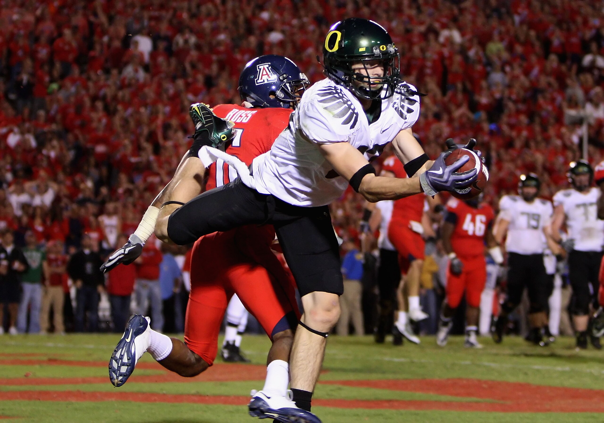 TUCSON, AZ - NOVEMBER 21: Wide receiver Jeff Maehl #23 of the Oregon Ducks makes a diving touchdown reception in the first overtime past Devin Ross #6 of the Arizona Wildcats during the college football game at Arizona Stadium on November 21, 2009 in Tuc TUCSON, AZ - NOVEMBER 21: Wide receiver Jeff Maehl #23 of the Oregon Ducks makes a diving touchdown reception in the first overtime past Devin Ross #6 of the Arizona Wildcats during the college football game at Arizona Stadium on November 21, 2009 in Tuc