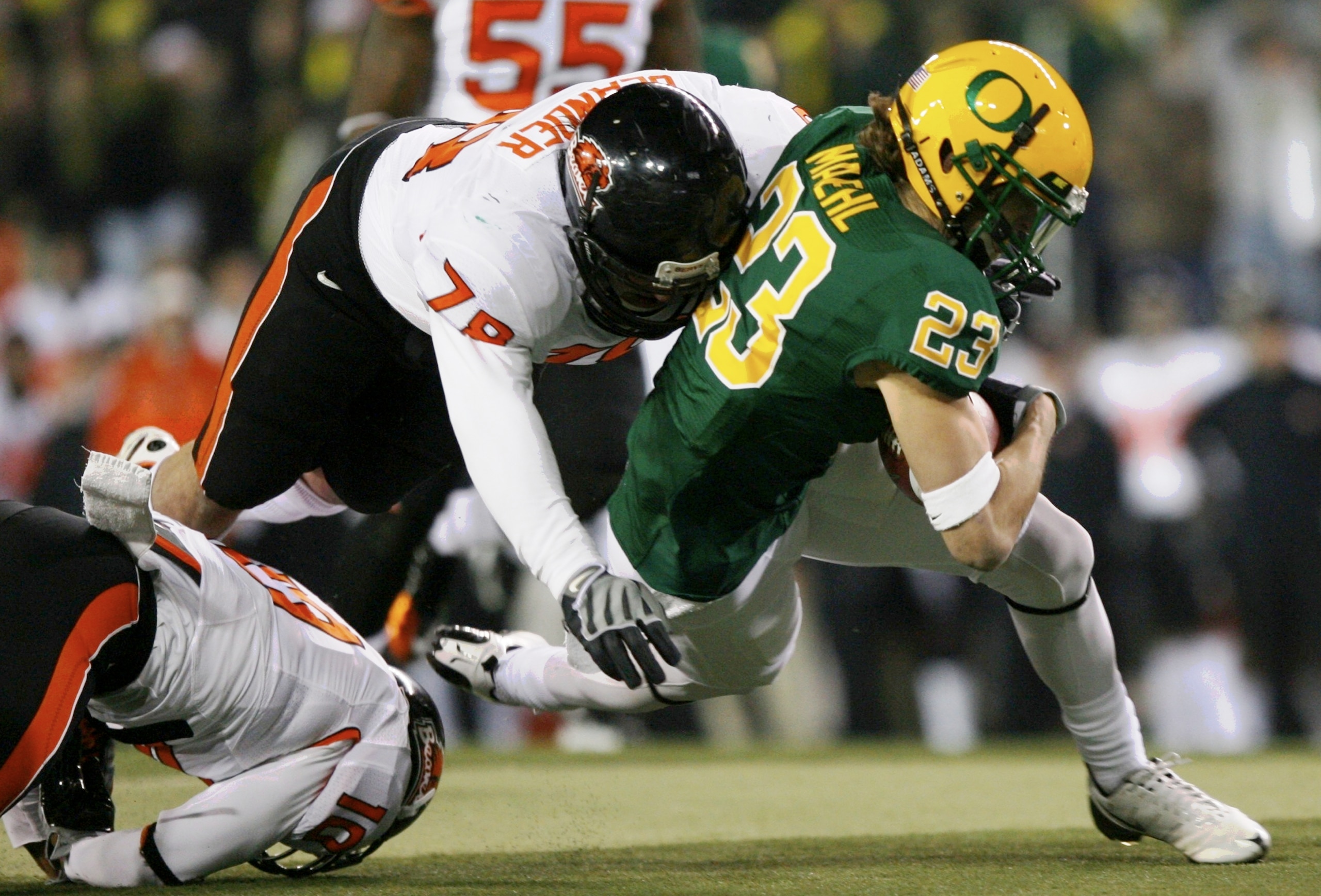 EUGENE,OR - DECEMBER 03: Brennan Olander #78 of the Oregon State Beavers tackles Jeff Maehl #23 of the Oregon Ducks during the second quarter of the game at Autzen Stadium on December 3, 2009 in Eugene, Oregon. (Photo by Tom Hauck/Getty Images) EUGENE,OR - DECEMBER 03: Brennan Olander #78 of the Oregon State Beavers tackles Jeff Maehl #23 of the Oregon Ducks during the second quarter of the game at Autzen Stadium on December 3, 2009 in Eugene, Oregon. (Photo by Tom Hauck/Getty Images)