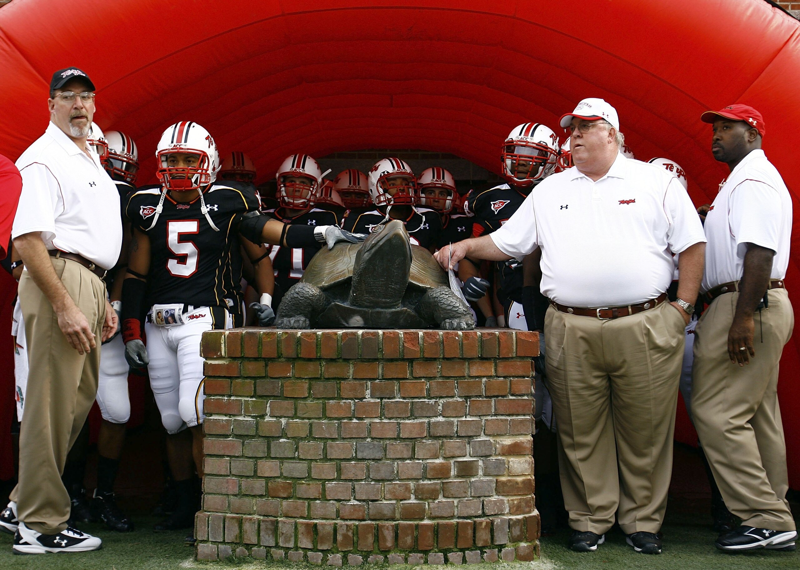 COLLEGE PARK, MD - NOVEMBER 11:  Head coach Ralph Friedgen of the Maryland Terrapins leads his team out of the locker room prior to the game against the Miami Hurricanes on November 11, 2006 at Byrd Stadium in College Park, Maryland.  (Photo by Jamie Squi