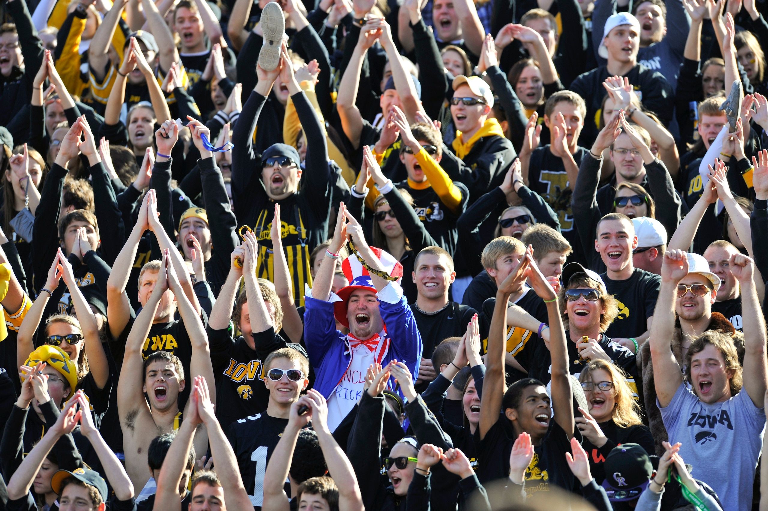 IOWA CITY, IA - OCTOBER 30- University of Iowa Hawkeyes fans cheer on their team during play against the Michigan State Spartans at Kinnick Stadium on October 30, 2010 in Iowa City, Iowa. Iowa won 37-6 over Michigan State. (Photo by David Purdy/Getty Imag