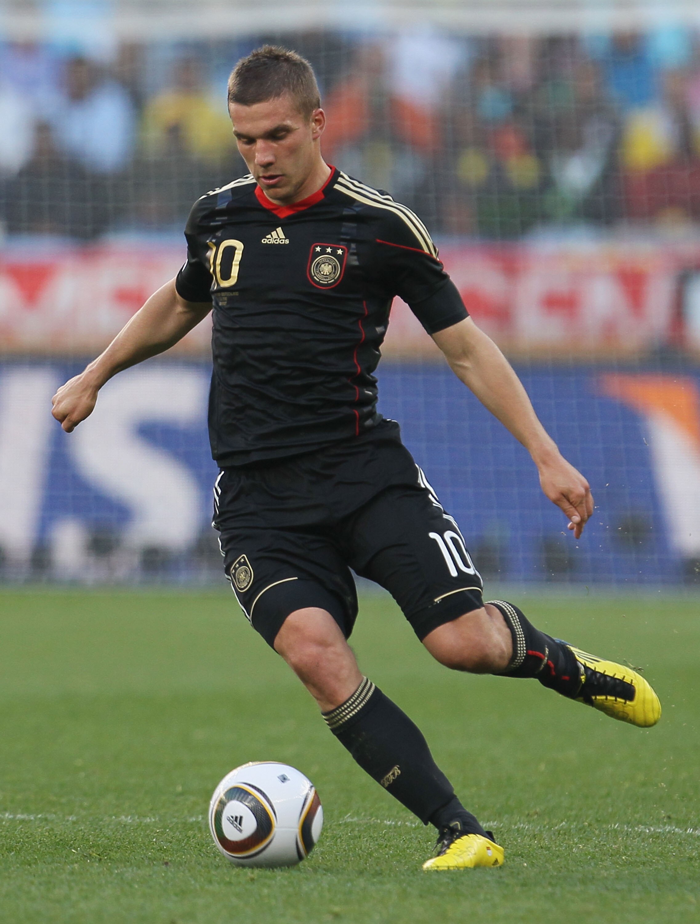 CAPE TOWN, SOUTH AFRICA - JULY 03:  Lukas Podolski runs with the ball during the 2010 FIFA World Cup South Africa Quarter Final match between Argentina and Germany at Green Point Stadium on July 3, 2010 in Cape Town, South Africa.  (Photo by Chris McGrath