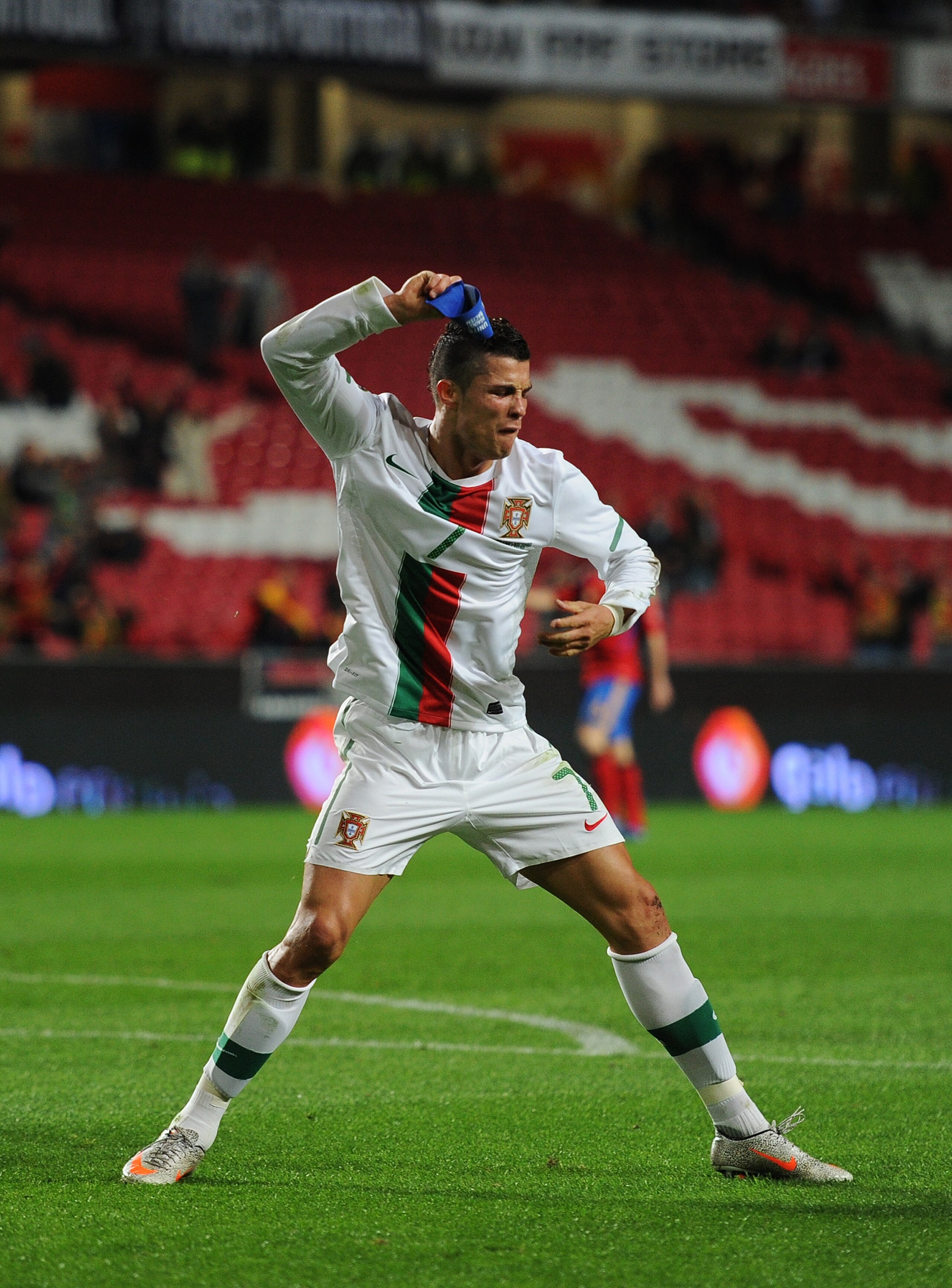 LISBON, PORTUGAL - NOVEMBER 17:  Cristiano Ronaldo of Portugal throws his captain's arm band away after his goal was disallowed during the International Friendly match between Portugal and Spain at the Estadio da Luz on November 17, 2010 in Lisbon, Portug