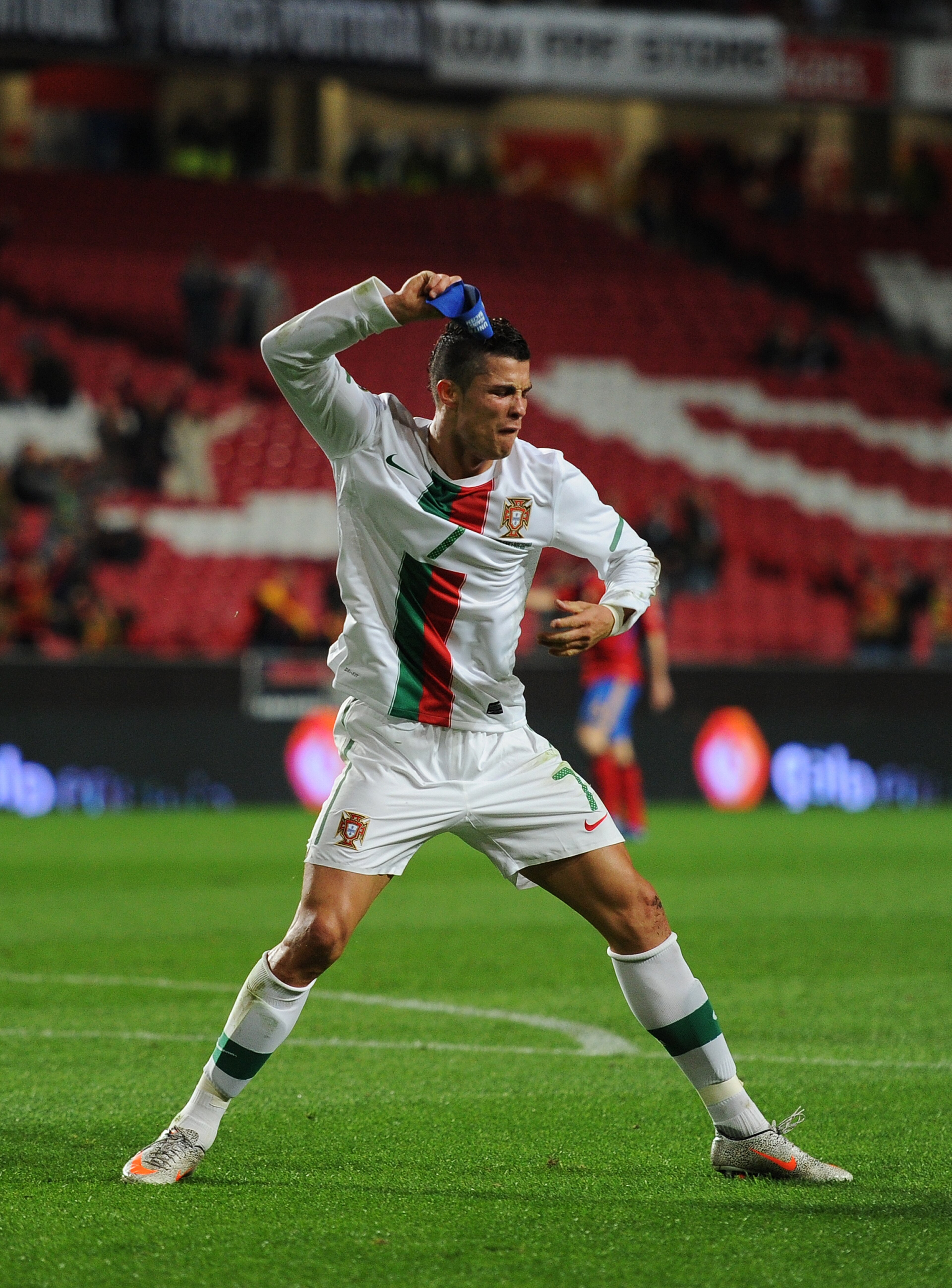 LISBON, PORTUGAL - NOVEMBER 17:  Cristiano Ronaldo of Portugal throws his captain's arm band away after his goal was disallowed during the International Friendly match between Portugal and Spain at the Estadio da Luz on November 17, 2010 in Lisbon, Portug