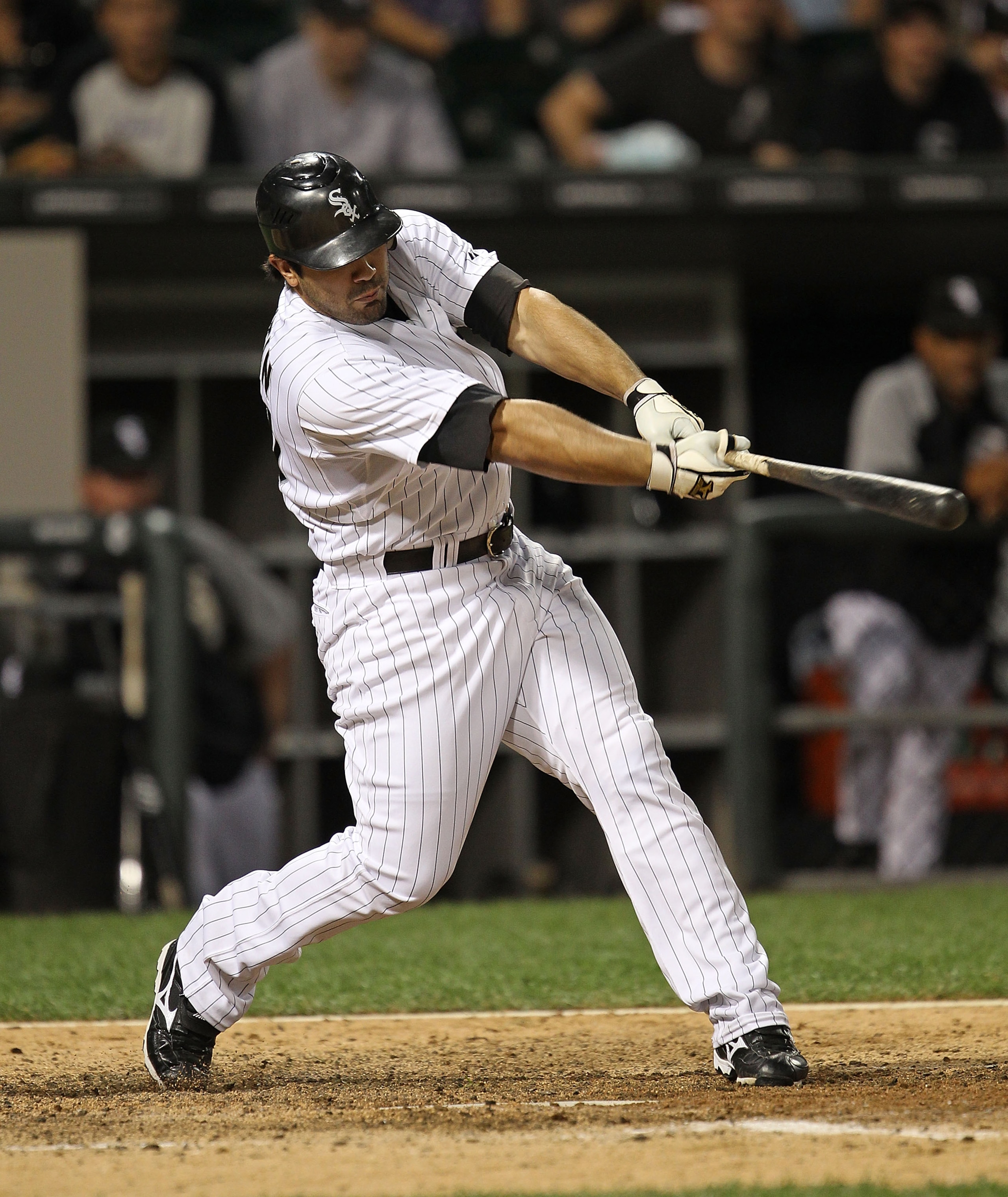 CHICAGO - AUGUST 25:Carlos Quentin #20 of the Chicago White Sox hits a triple in the 9th inning against the Baltimore Orioles at U.S. Cellular Field on August 25, 2010 in Chicago, Illinois. The Orioles defeated the White Sox 4-2. (Photo by Jonathan Daniel