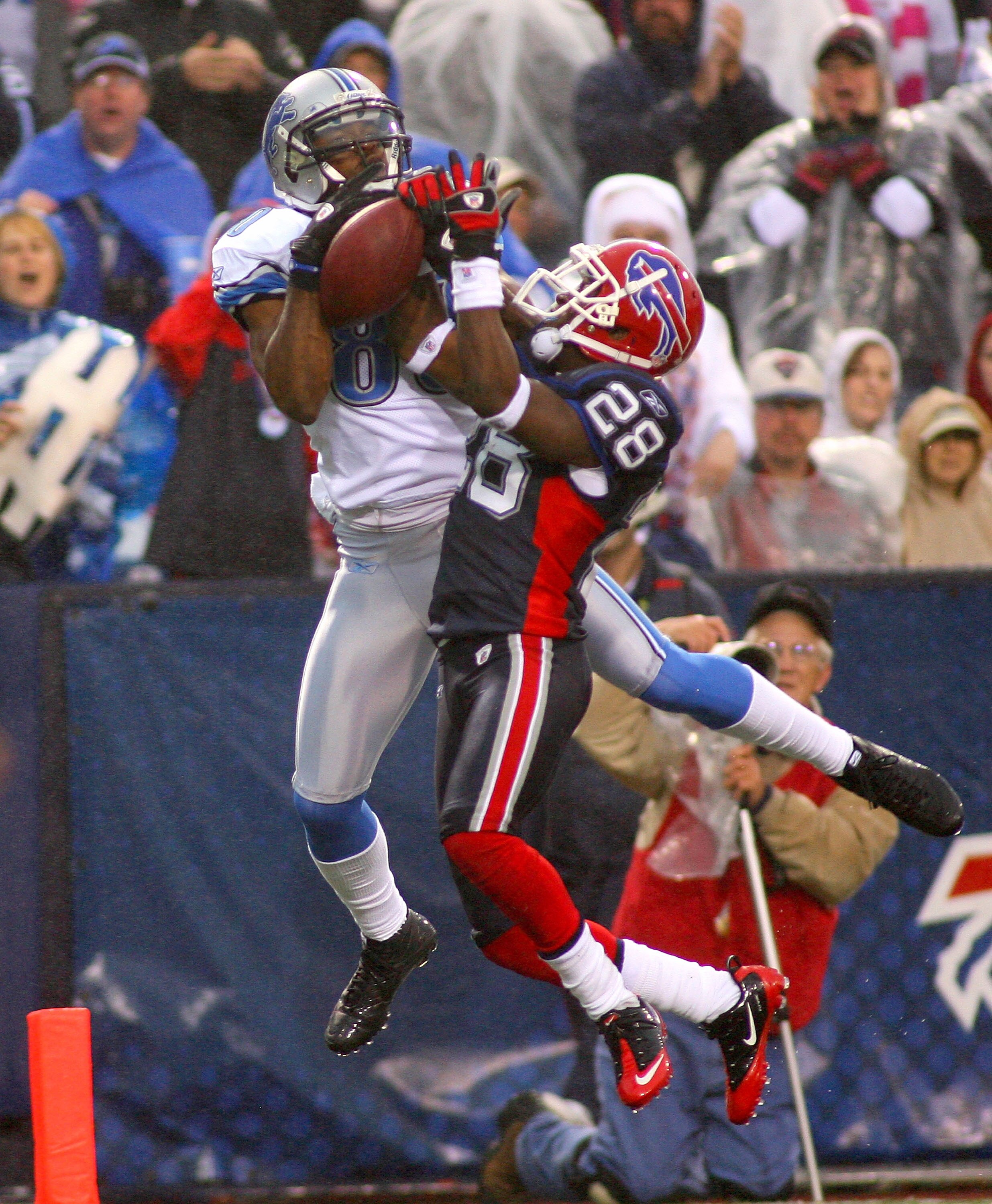 ORCHARD PARK, NY - NOVEMBER 14:  Leodis McKelvin #28 of the Buffalo Bills strips the ball away from Calvin Johnson #81 of the Detroit Lions at Ralph Wilson Stadium on November 14, 2010 in Orchard Park, New York. Buffalo won 14-12.  (Photo by Rick Stewart/
