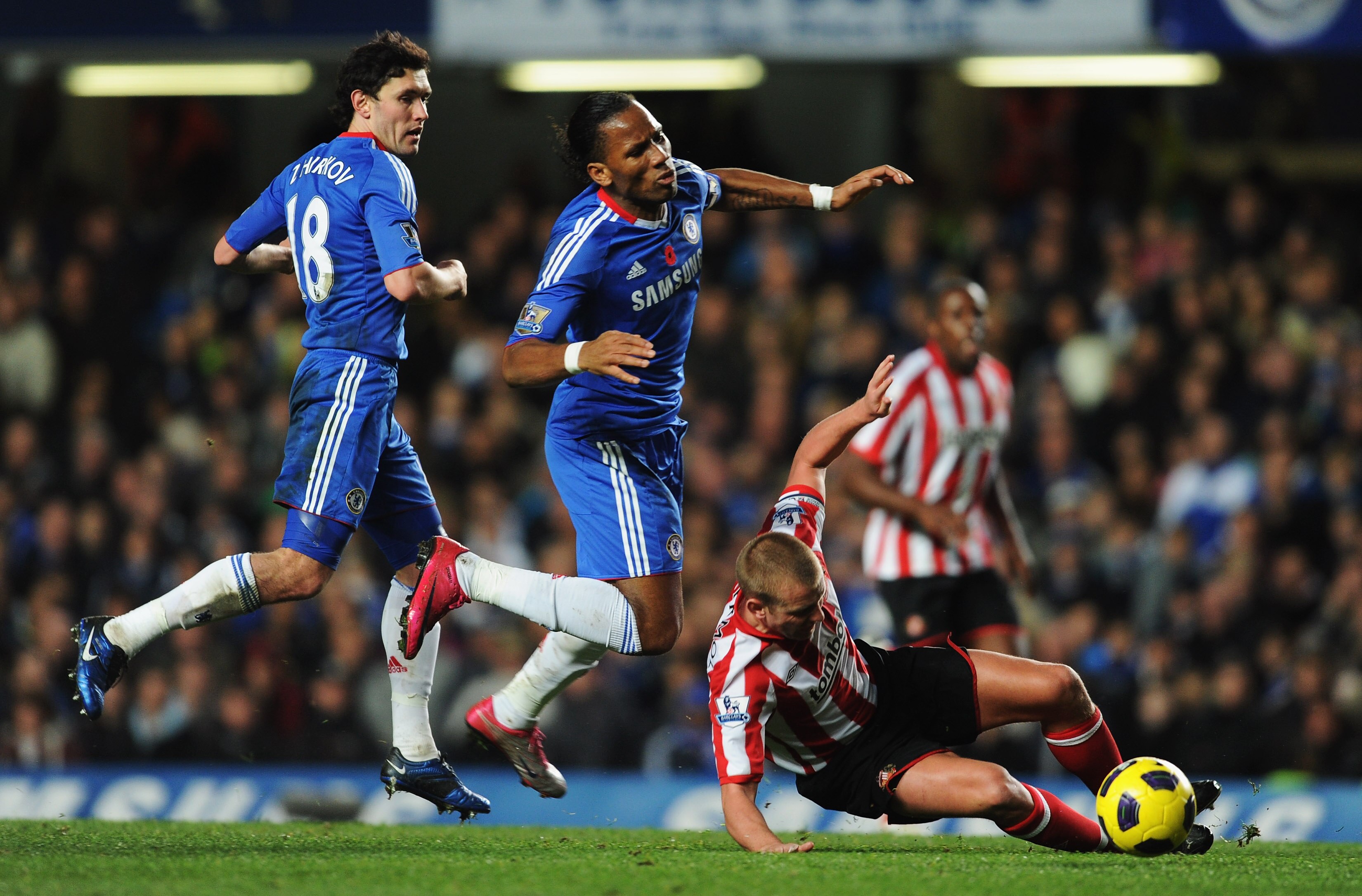 LONDON, ENGLAND - NOVEMBER 14:  Didier Drogba of Chelsea is tackled by Lee Cattermole of Sunderland during the Barclays Premier League match between Chelsea and Sunderland at Stamford Bridge on November 14, 2010 in London, England.  (Photo by Michael Rega