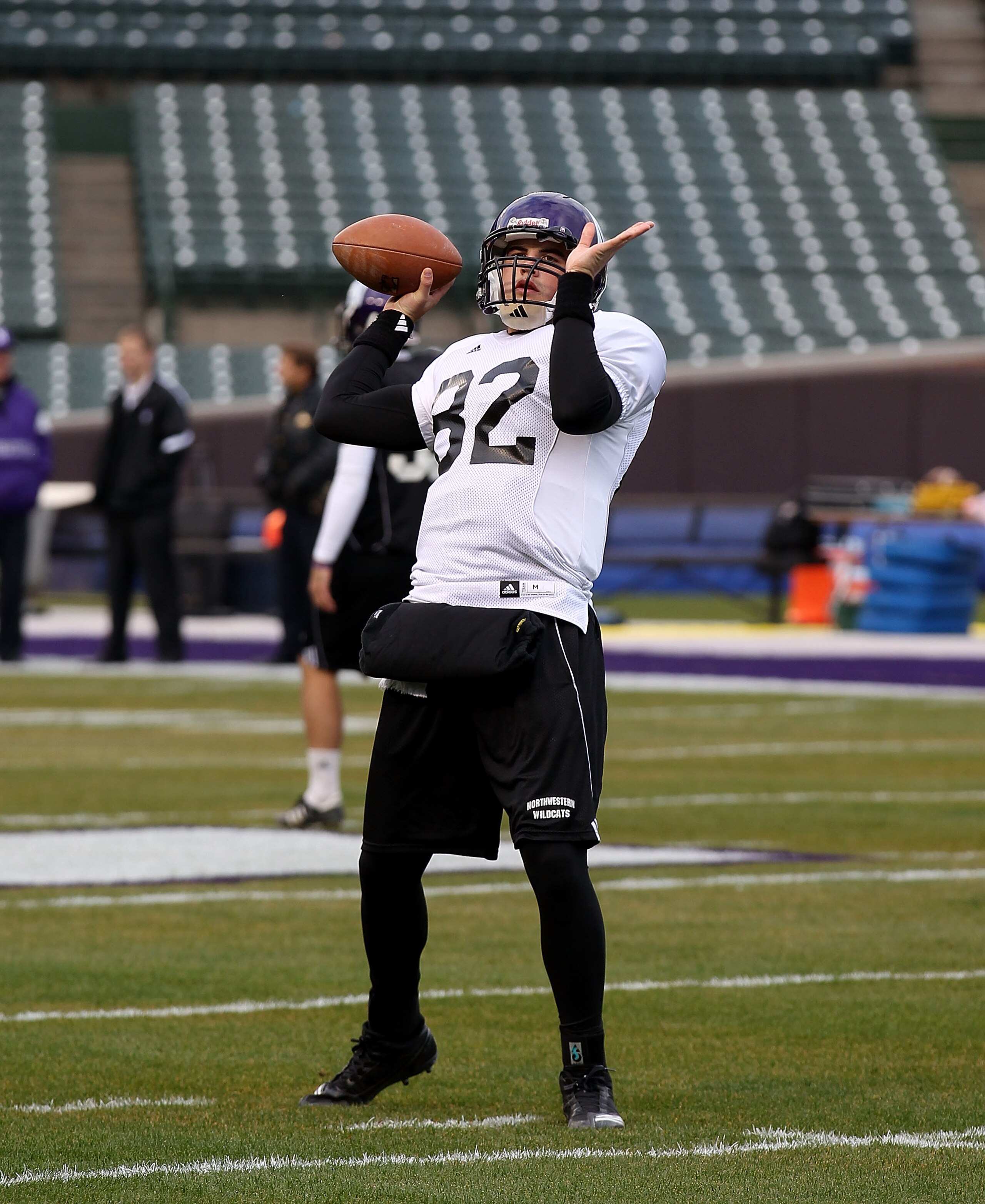 CHICAGO - NOVEMBER 18: Evan Watkins #82 of Northwestern Wildcats, who will start at quarterback, throws a pass during practice for a game against the Illinois Fighting Illini on Saturday November 20 at Wrigley Field on November 18, 2010 in Chicago, Illino CHICAGO - NOVEMBER 18: Evan Watkins #82 of Northwestern Wildcats, who will start at quarterback, throws a pass during practice for a game against the Illinois Fighting Illini on Saturday November 20 at Wrigley Field on November 18, 2010 in Chicago, Illino