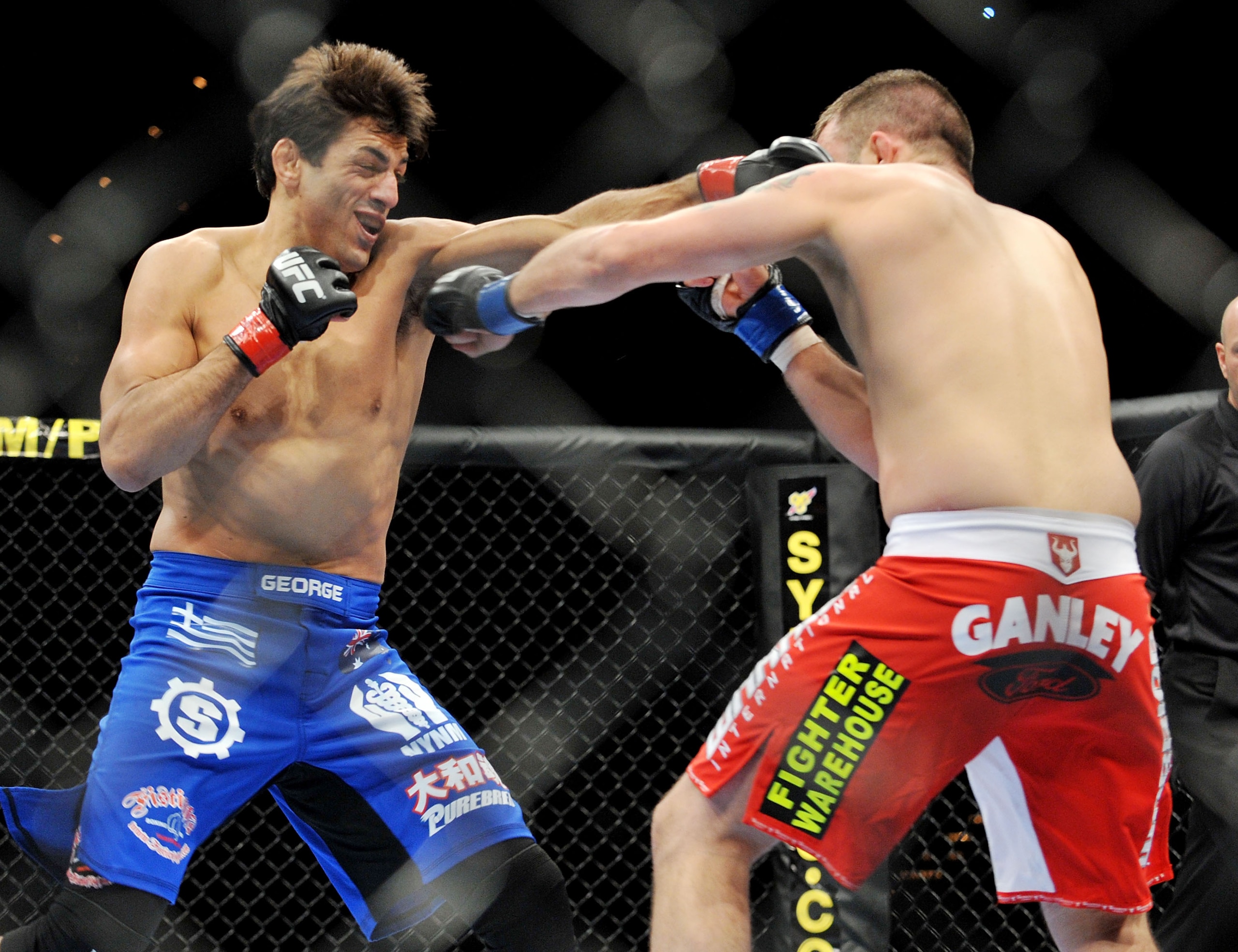 LAS VEGAS - NOVEMBER 21: George Sotiropoulos (L) battles Jason Dent (R) during their Lightweight Fight at the UFC 106 at Mandalay Bay Events Center on November 21, 2009 in Las Vegas, Nevada. (Photo by Jon Kopaloff/Getty Images)