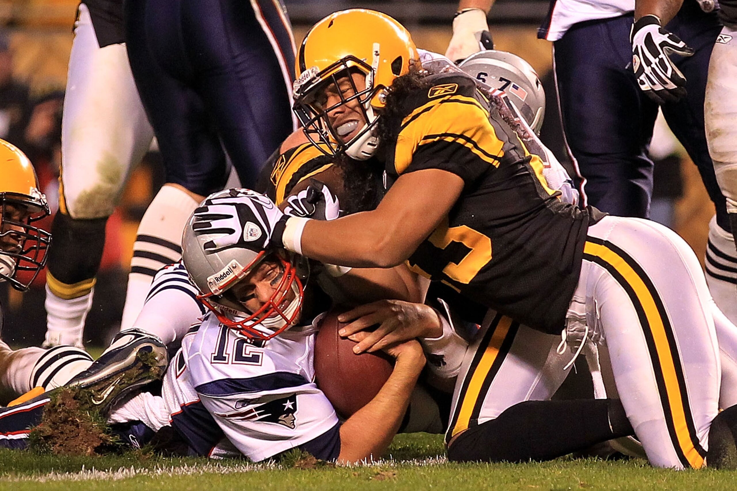PITTSBURGH - NOVEMBER 14:  Tom Brady #12 of the New England Patriots scores a touchdown under pressure from Troy Polamalu #43 of the Pittsburgh Steelers on November 14, 2010 at Heinz Field in Pittsburgh, Pennsylvania.  (Photo by Chris McGrath/Getty Images