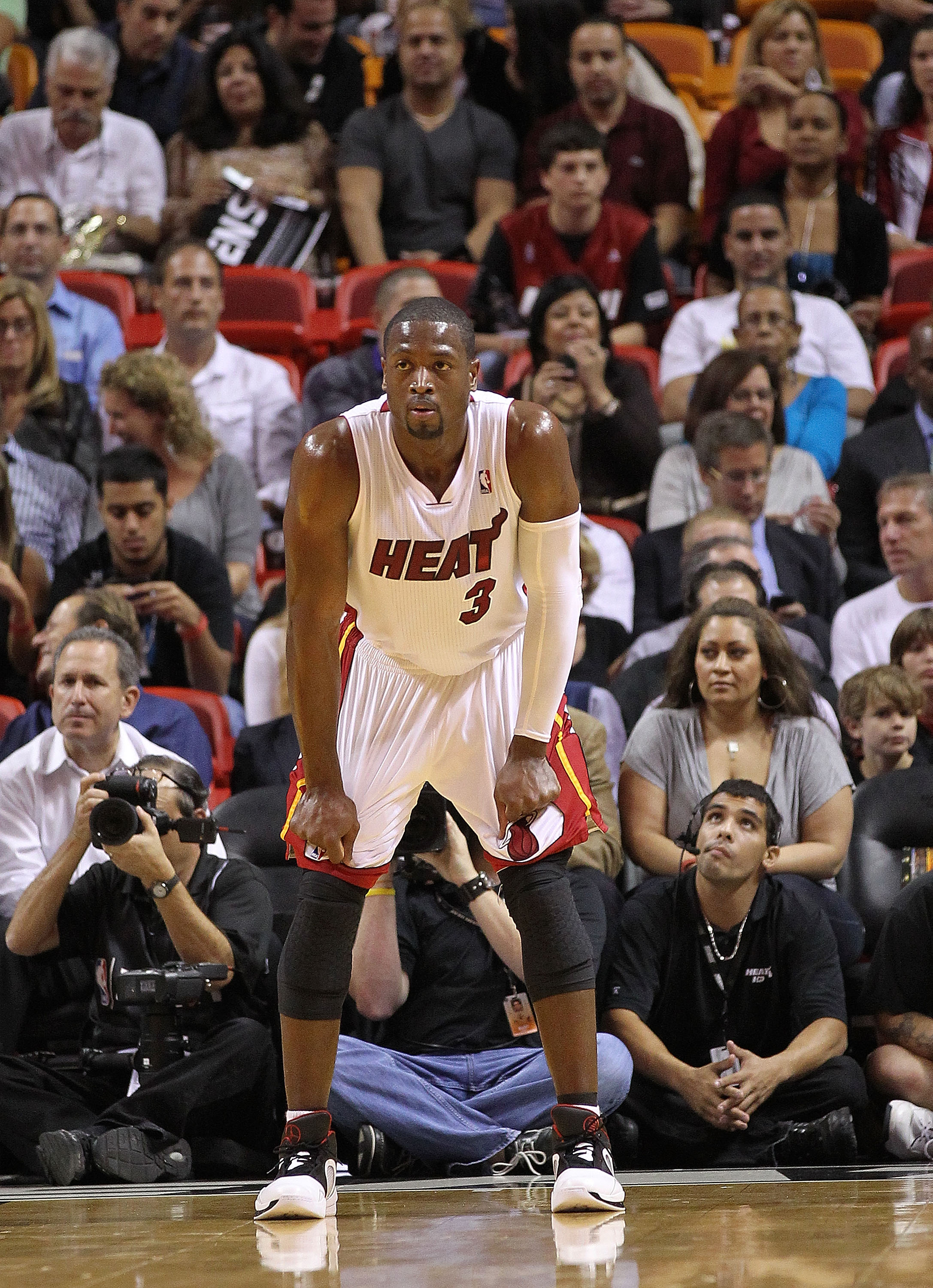 MIAMI - NOVEMBER 17:  Dwyane Wade #3 of the Miami Heat watches a foul shot during a game against the Phoenix Suns at American Airlines Arena on November 17, 2010 in Miami, Florida. NOTE TO USER: User expressly acknowledges and agrees that, by downloading 