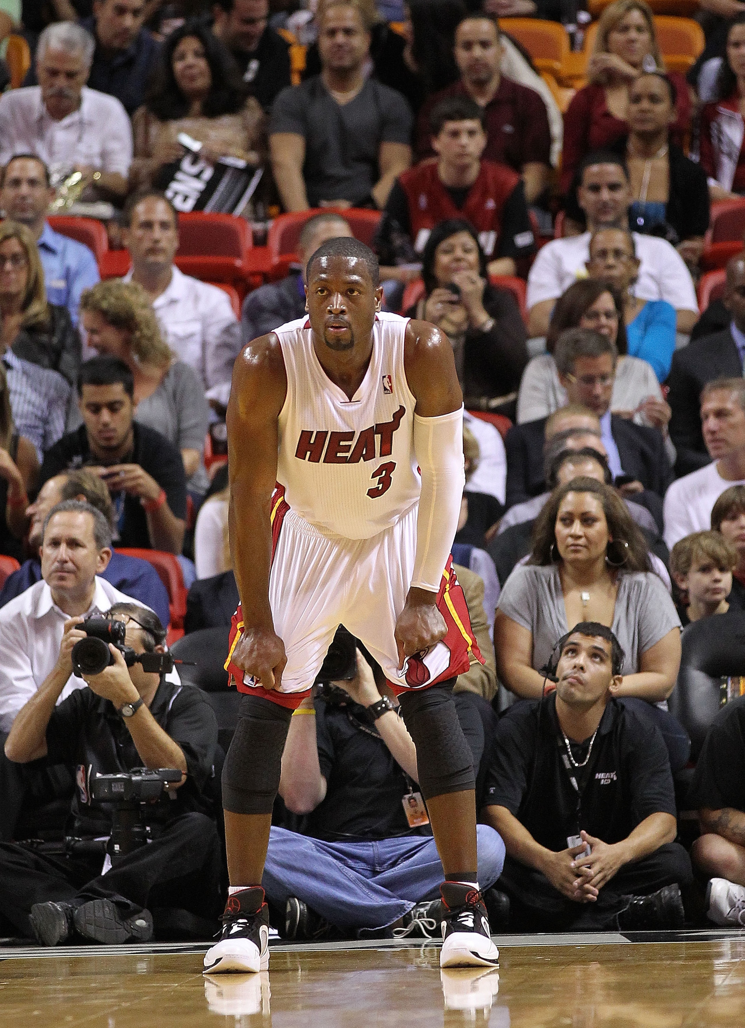 MIAMI - NOVEMBER 17:  Dwyane Wade #3 of the Miami Heat watches a foul shot during a game against the Phoenix Suns at American Airlines Arena on November 17, 2010 in Miami, Florida. NOTE TO USER: User expressly acknowledges and agrees that, by downloading 