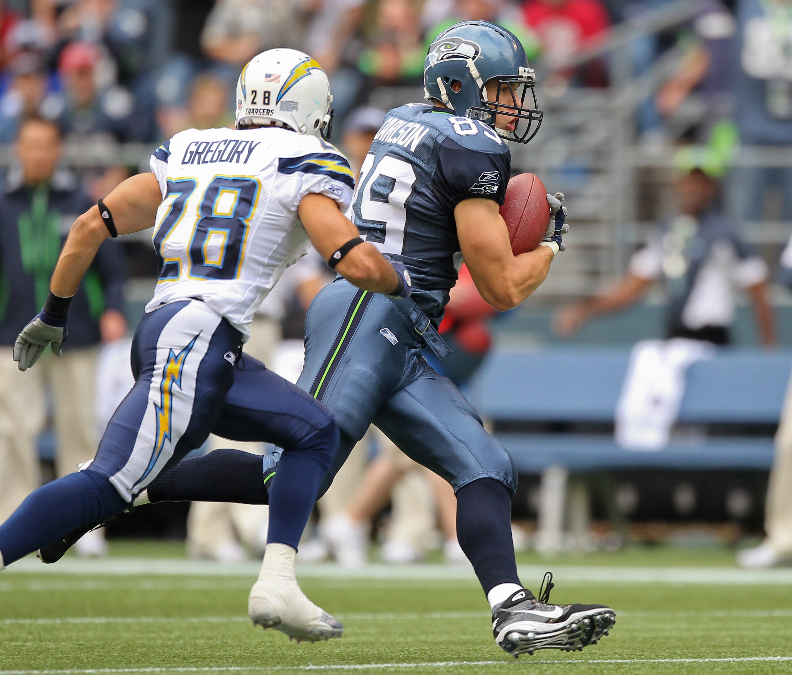 SEATTLE - SEPTEMBER 26:  Tight end John Carlson #89 of the Seattle Seahawks rushes against Steve Gregory #28 of the San Diego Chargers at Qwest Field on September 26, 2010 in Seattle, Washington. (Photo by Otto Greule Jr/Getty Images)