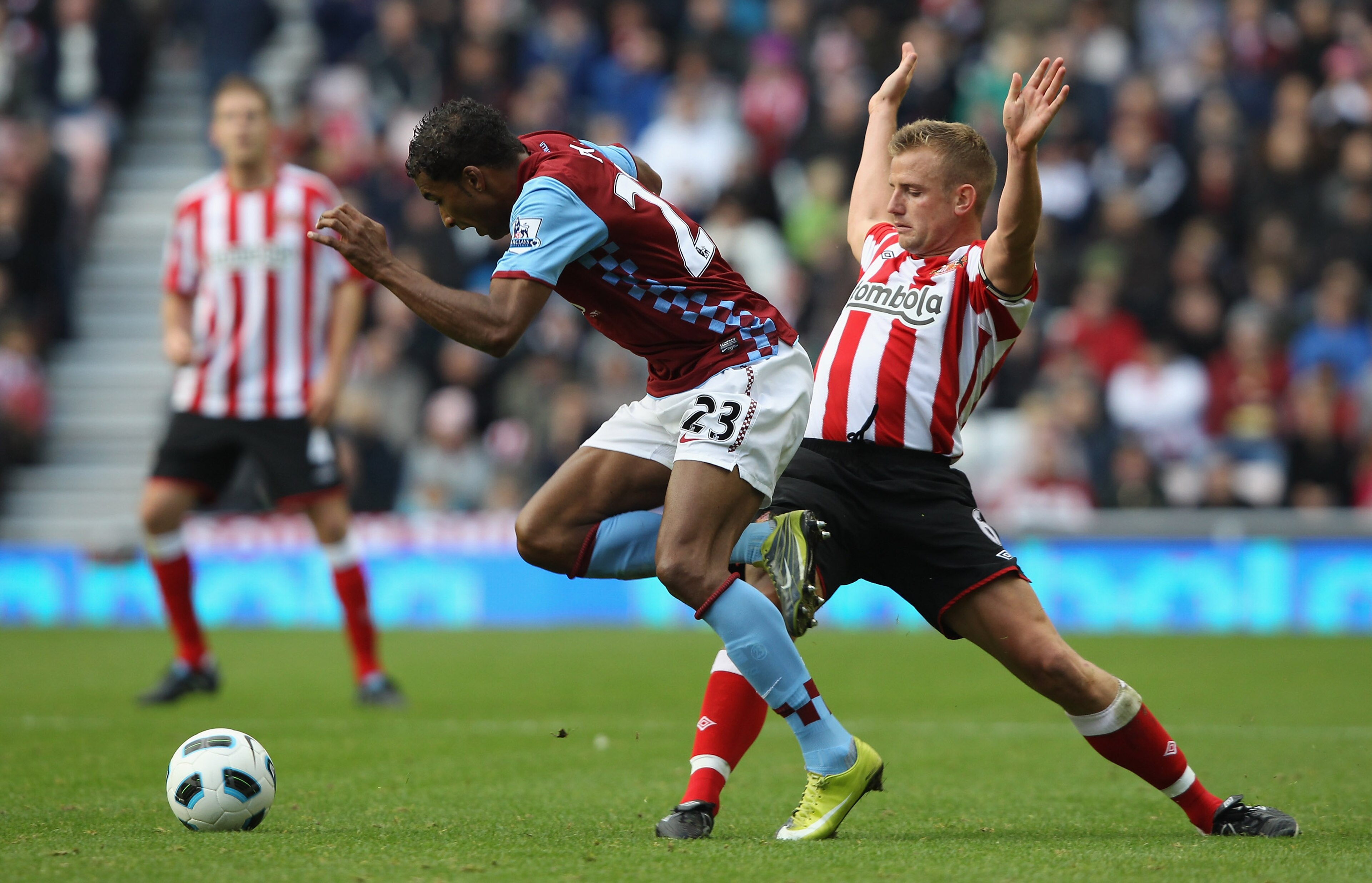 SUNDERLAND, ENGLAND - OCTOBER 23: Habib Baye of Aston Villa leaps over a challenge from Lee Cattermole of Sunderland during the Barclays Premier League match between Sunderland and Aston Villa at Stadium of Light on October 23, 2010 in Sunderland, Engla SUNDERLAND, ENGLAND - OCTOBER 23: Habib Baye of Aston Villa leaps over a challenge from Lee Cattermole of Sunderland during the Barclays Premier League match between Sunderland and Aston Villa at Stadium of Light on October 23, 2010 in Sunderland, Engla