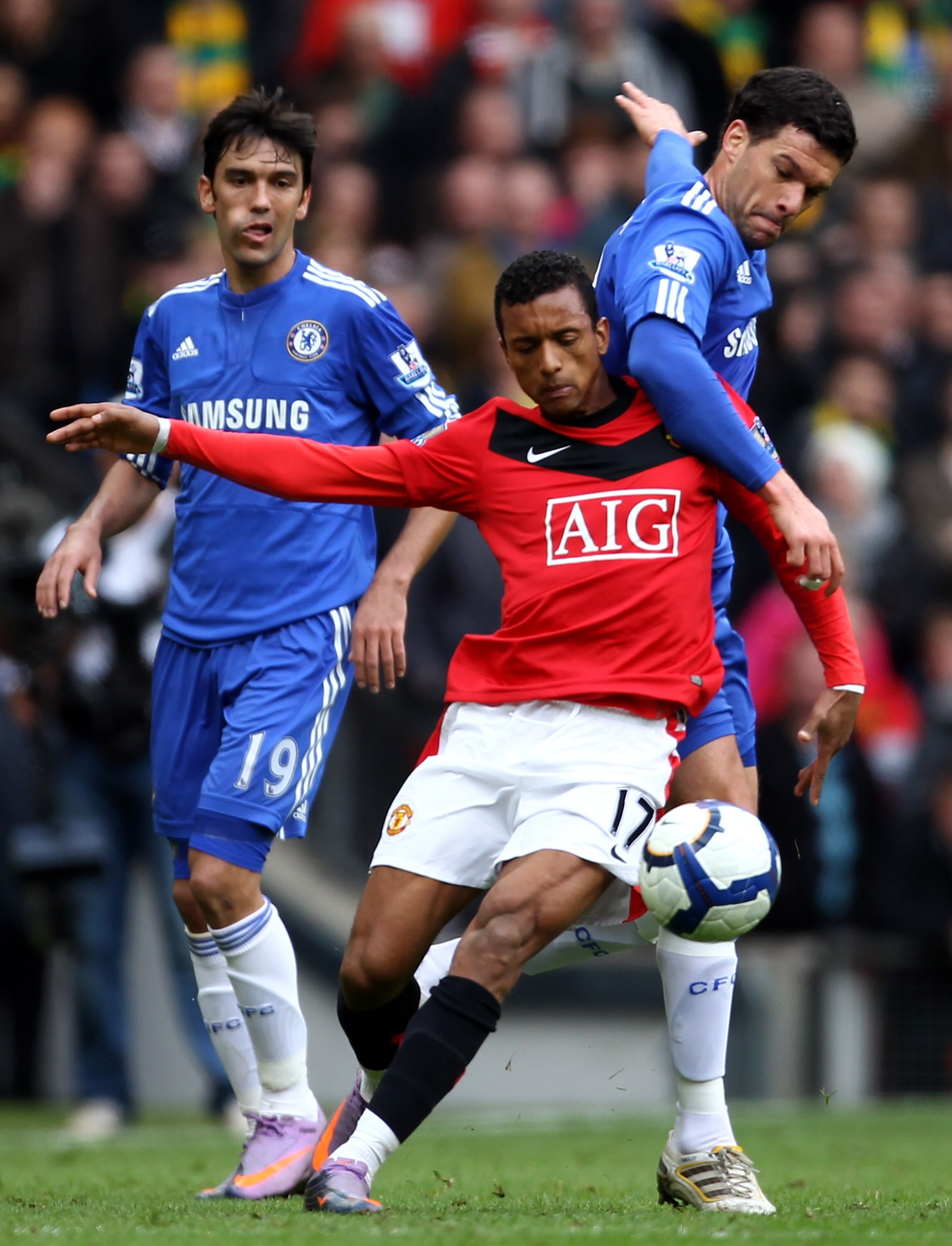MANCHESTER, ENGLAND - APRIL 03:  Michael Ballack of Chelsea challenges Nani of Manchester United during the Barclays Premier League match between Manchester United and Chelsea at Old Trafford on April 3, 2010 in Manchester, England. (Photo by Alex Livesey