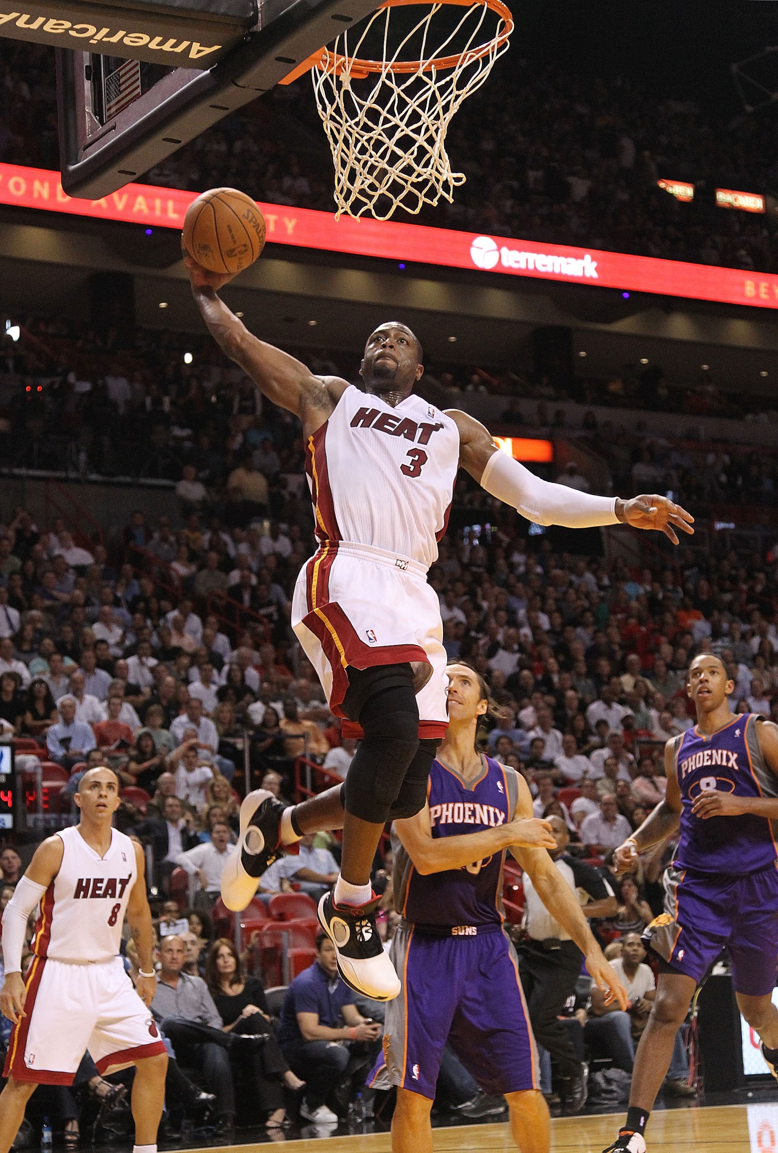 MIAMI - NOVEMBER 17:  Dwyane Wade #3 of the Miami Heat dunks during a game against the Phoenix Suns at American Airlines Arena on November 17, 2010 in Miami, Florida. NOTE TO USER: User expressly acknowledges and agrees that, by downloading and/or using t