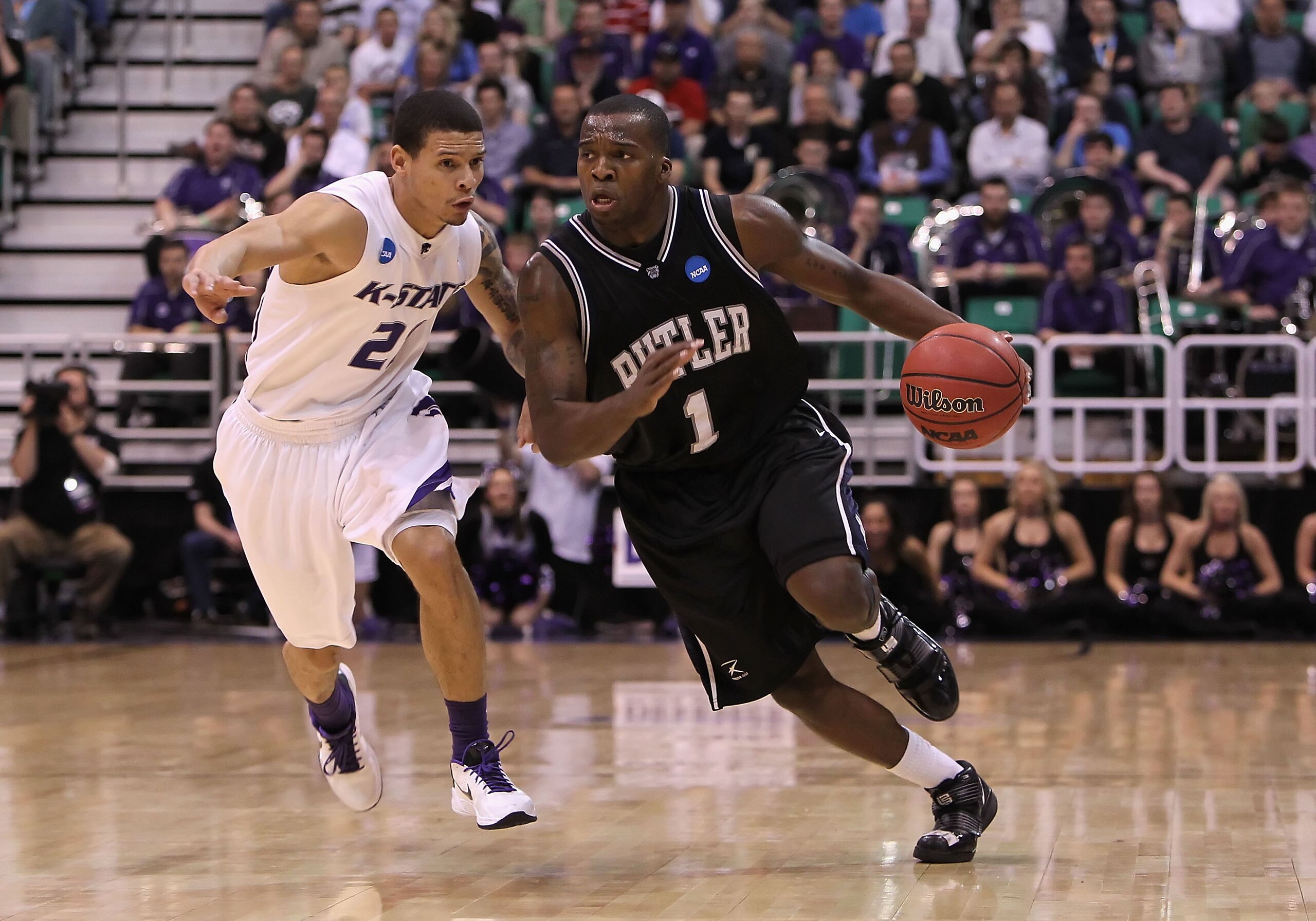 SALT LAKE CITY - MARCH 27: Shelvin Mack #1 of the Butler Bulldogs drives the ball past Denis Clemente #21 of the Kansas State Wildcats during the west regional final of the 2010 NCAA men's basketball tournament at the Energy Solutions Arena on March 27, SALT LAKE CITY - MARCH 27: Shelvin Mack #1 of the Butler Bulldogs drives the ball past Denis Clemente #21 of the Kansas State Wildcats during the west regional final of the 2010 NCAA men's basketball tournament at the Energy Solutions Arena on March 27,