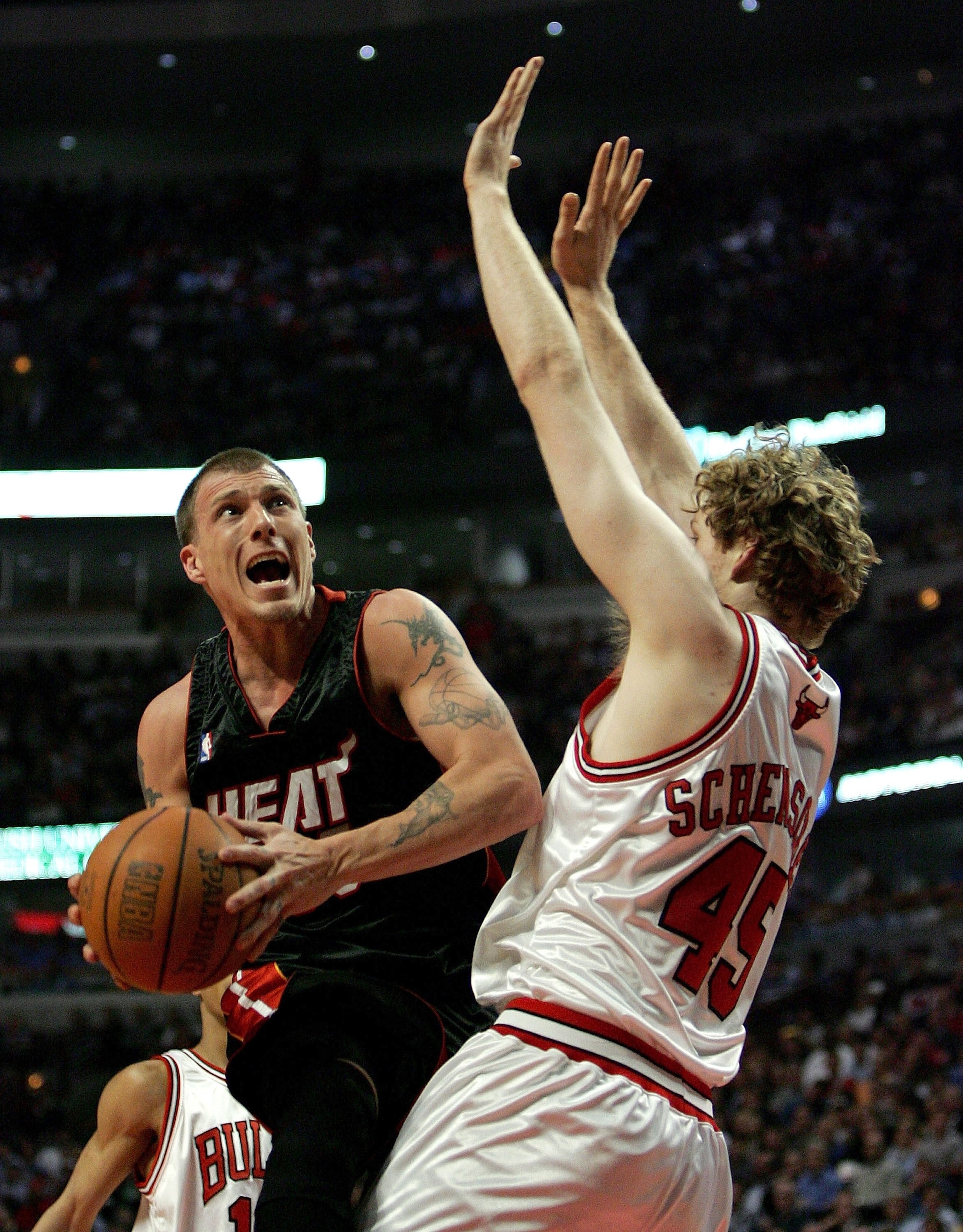 CHICAGO - APRIL 27:  Jason Williams #55 of the Miami Heat puts up a shot against Luke Schensher #45 of the Chicago Bulls in game three of the Eastern Conference Quarterfinals during the 2006 NBA Playoffs on April 27, 2006 at the United Center in Chicago, 