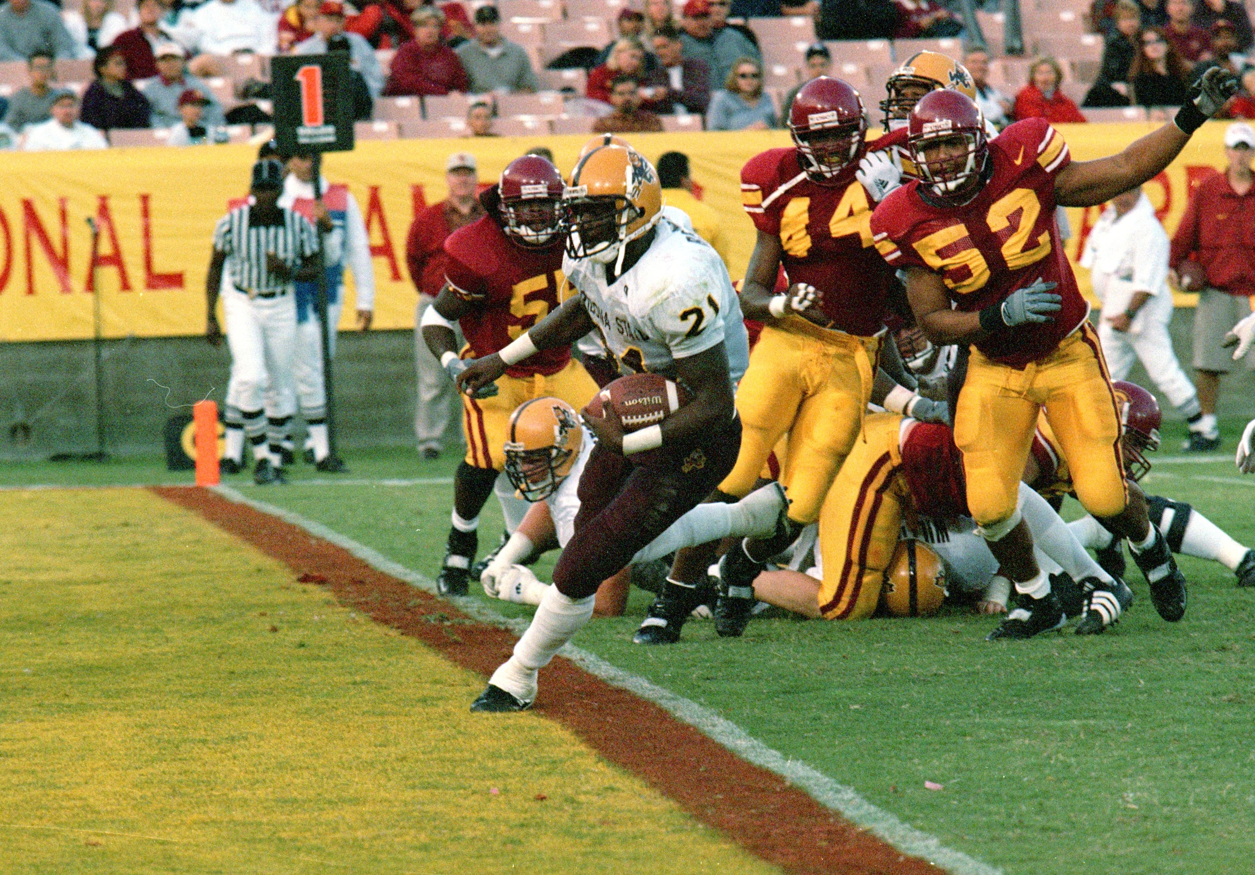 6 Nov 1999:  J.R Redmond #21 of the Arizona State Sun Devils carries the ball in for a touchdown during the game against the USC Trojans at the LA Coliseum in Los Angeles, California. The Sun Devils defeated the Trojans 26-16. Mandatory Credit: Steve Gray