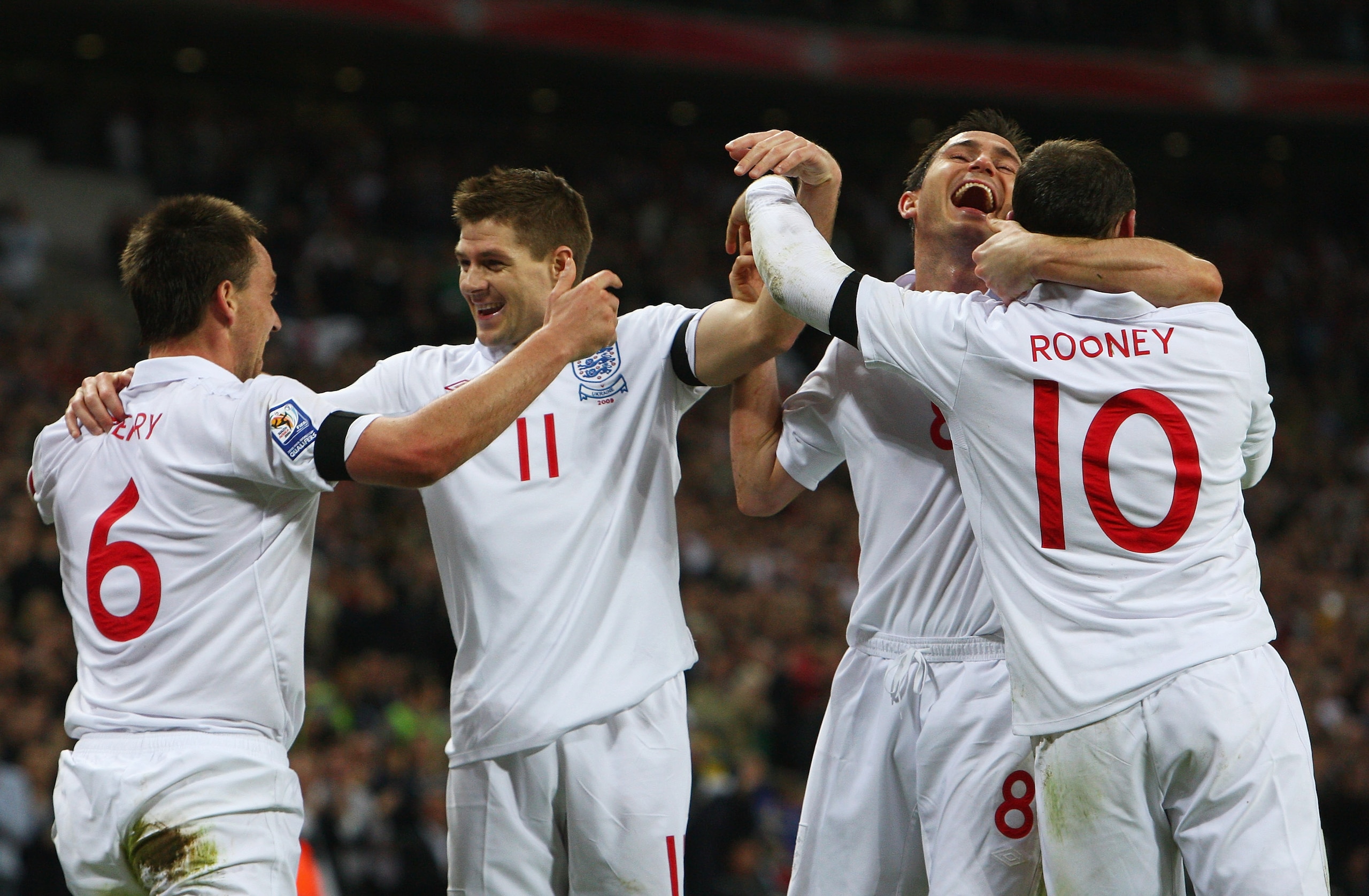 LONDON - APRIL 01: John Terry (L) of England celebrates scoring his goal with Steven Gerrard, Frank Lampard and Wayne Rooney during the FIFA 2010 World Cup Group 6 Qualifying match between England and Ukraine at Wembley Stadium on April 1, 2009 in London LONDON - APRIL 01: John Terry (L) of England celebrates scoring his goal with Steven Gerrard, Frank Lampard and Wayne Rooney during the FIFA 2010 World Cup Group 6 Qualifying match between England and Ukraine at Wembley Stadium on April 1, 2009 in London