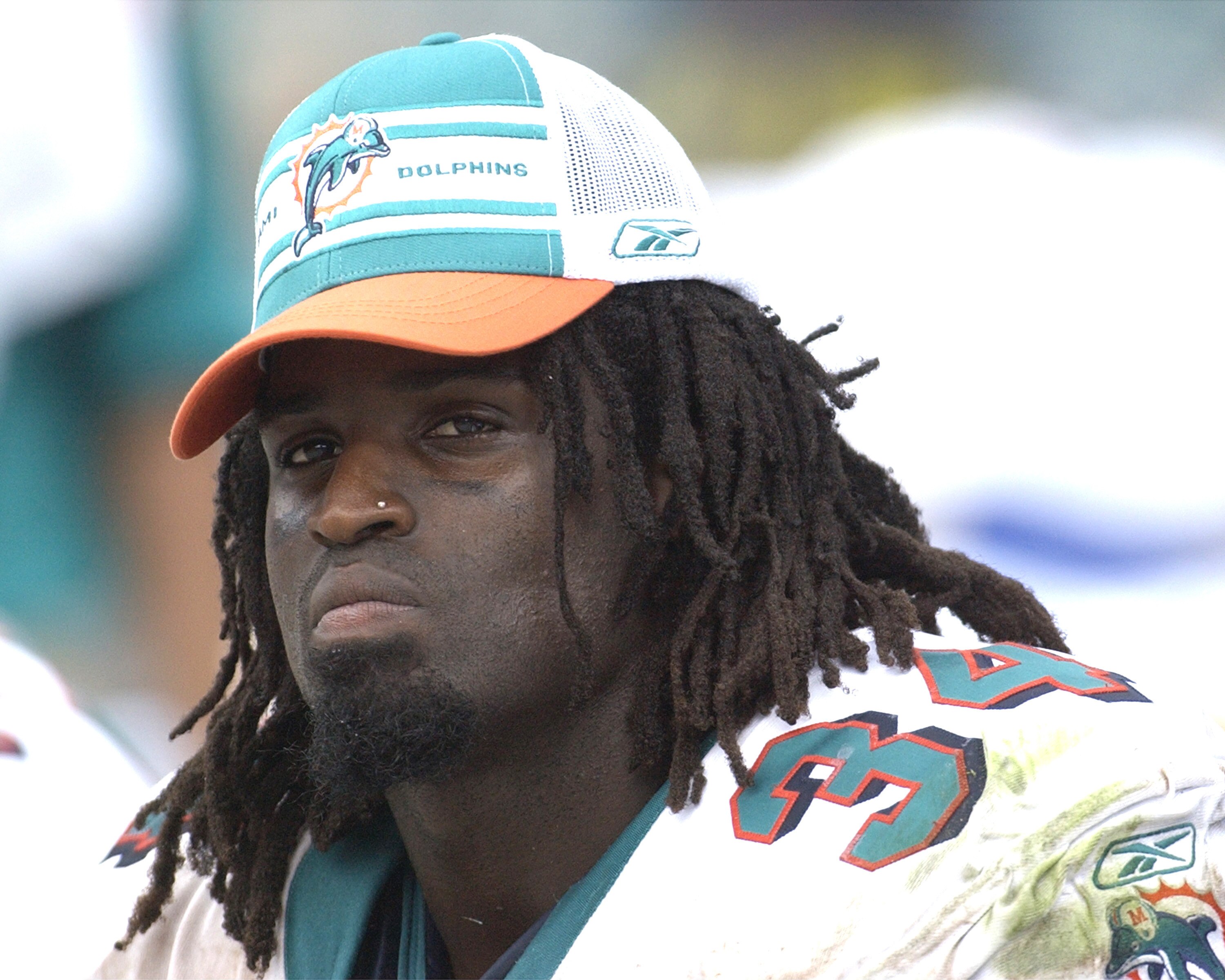 Miami Dolphins running back Ricky Williams checks play   September 7, 2003 at Pro Player Stadium, Miami, Florida. The Houston Texans defeated the Dolphins 21 - 20 to open the NFL football season.  (Photo by Al Messerschmidt/Getty Images)