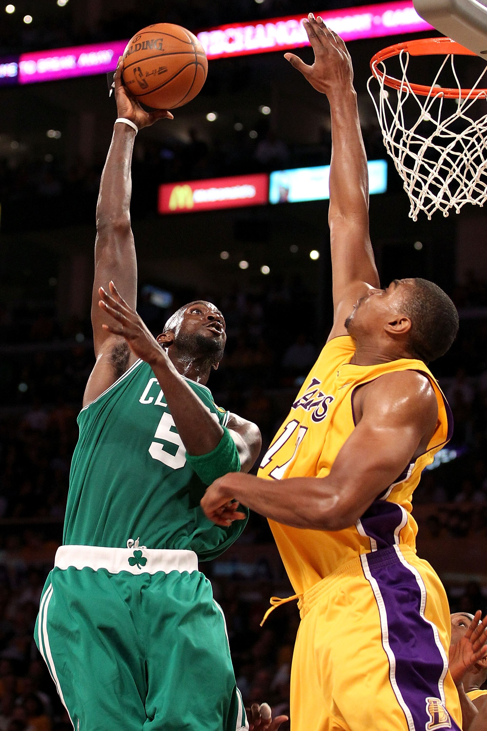 LOS ANGELES, CA - JUNE 17:  Kevin Garnett #5 of the Boston Celtics puts a shot up over Andrew Bynum #17 of the Los Angeles Lakers in Game Seven of the 2010 NBA Finals at Staples Center on June 17, 2010 in Los Angeles, California.  NOTE TO USER: User expre