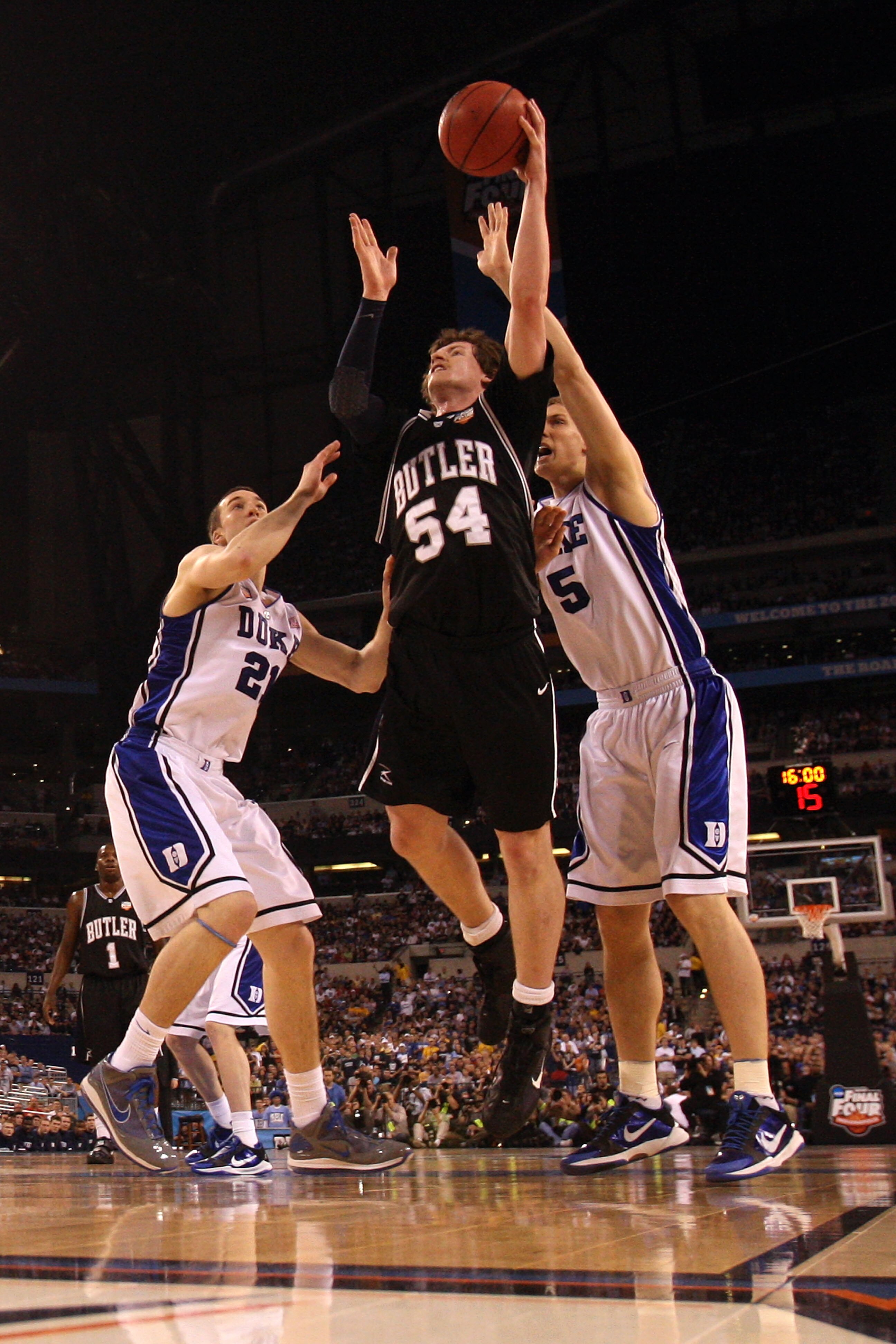 INDIANAPOLIS - APRIL 05:  Matt Howard #54 of the Butler Bulldogs attempts a shot against Miles Plumlee #21 and Mason Plumlee #5 of the Duke Blue Devils during the 2010 NCAA Division I Men's Basketball National Championship game at Lucas Oil Stadium on Apr