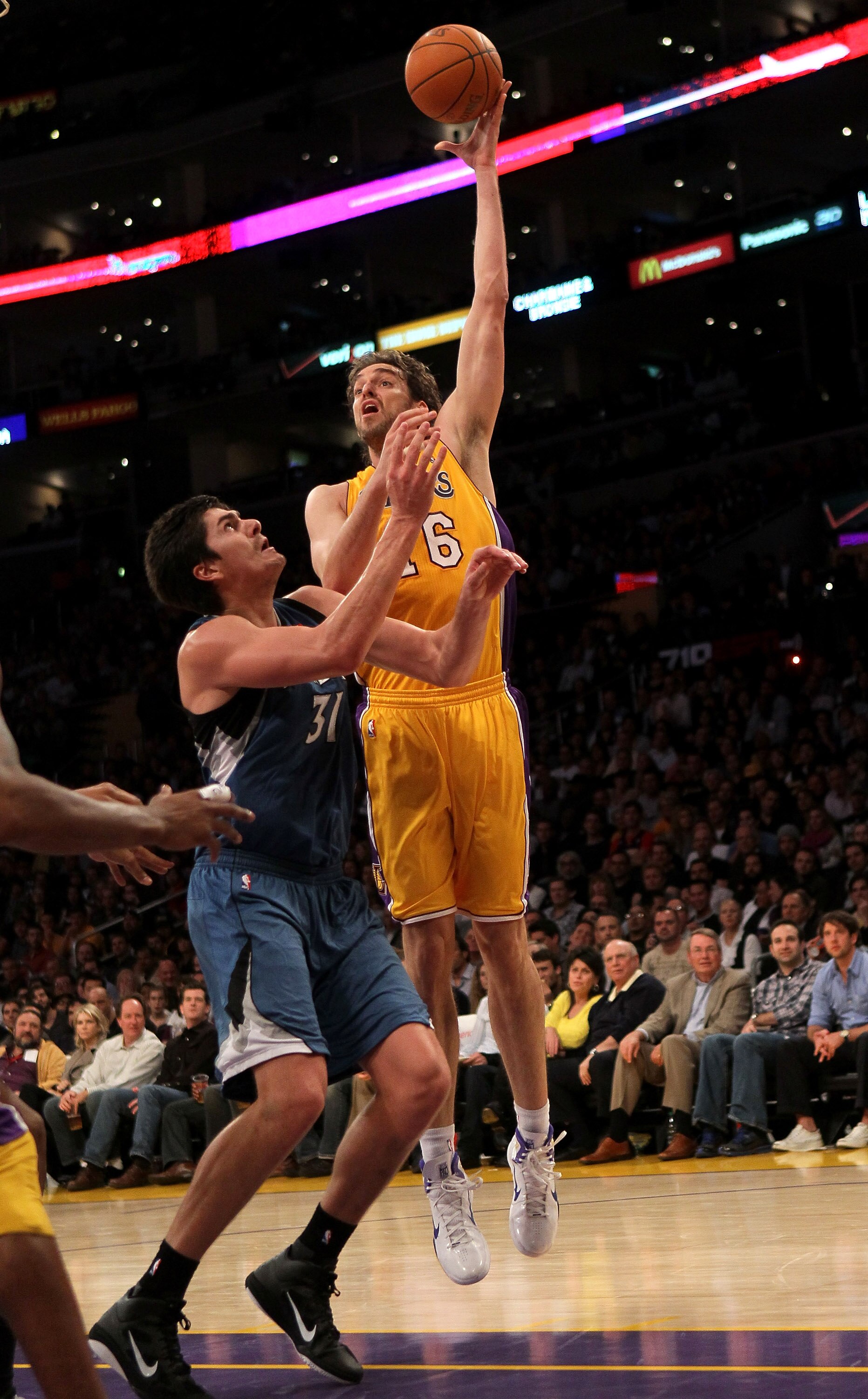 LOS ANGELES - NOVEMBER 9:  Pau Gasol #16 of the Los Angeles Lakers shoots over Darko Milicic #31 of the Minnesota Timberwolves at Staples Center on November 9, 2010 in Los Angeles, California.   NOTE TO USER: User expressly acknowledges and agrees that, b