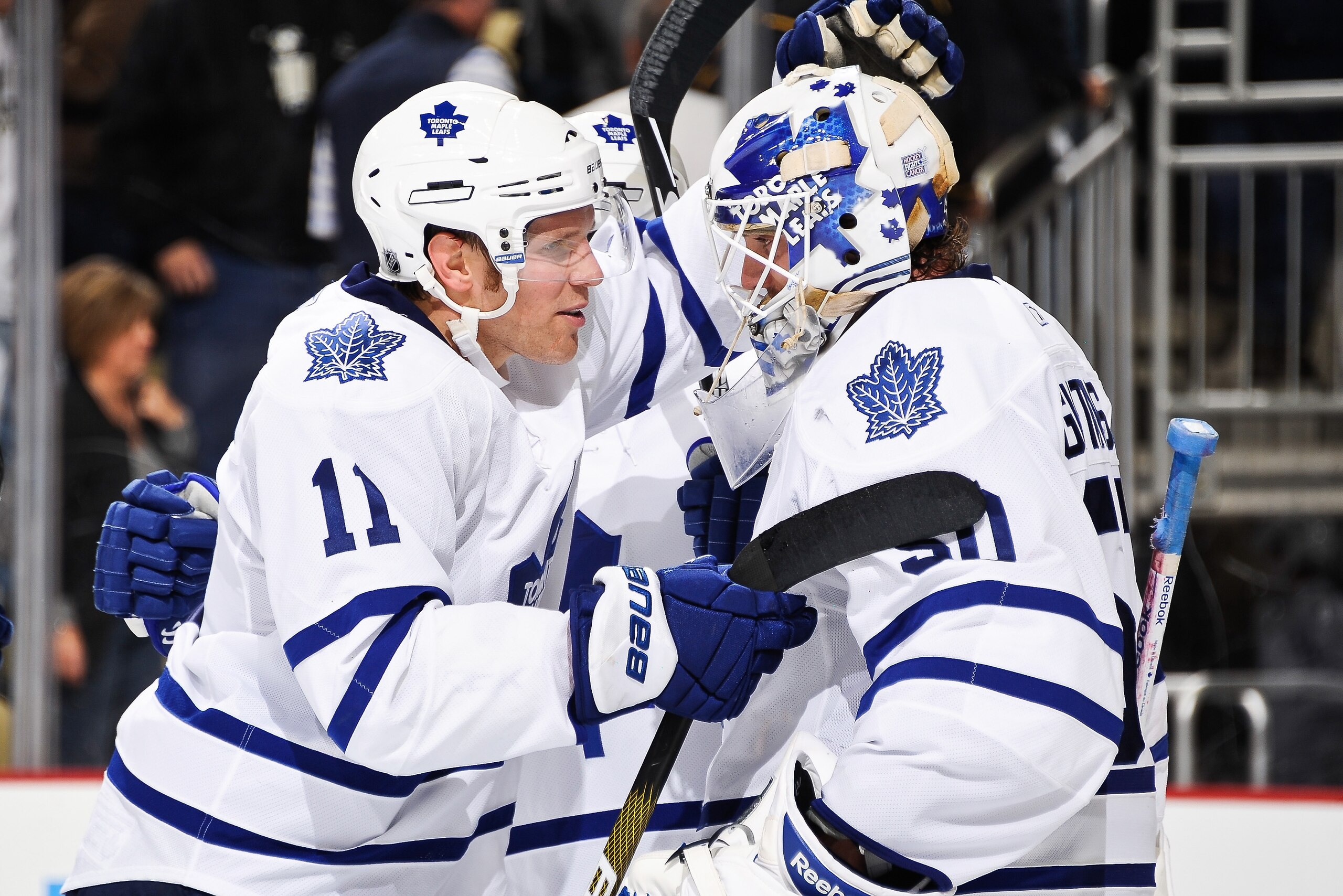 PITTSBURGH - OCTOBER 13:  Fredrik Sjostrom #11 of the Toronto Maple Leafs congratulates goaltender Jonas Gustavsson #50 of the Toronto Maple Leafs after a win over the Pittsburgh Penguins on October 13, 2010 at Consol Energy Center in Pittsburgh, Pennsylv