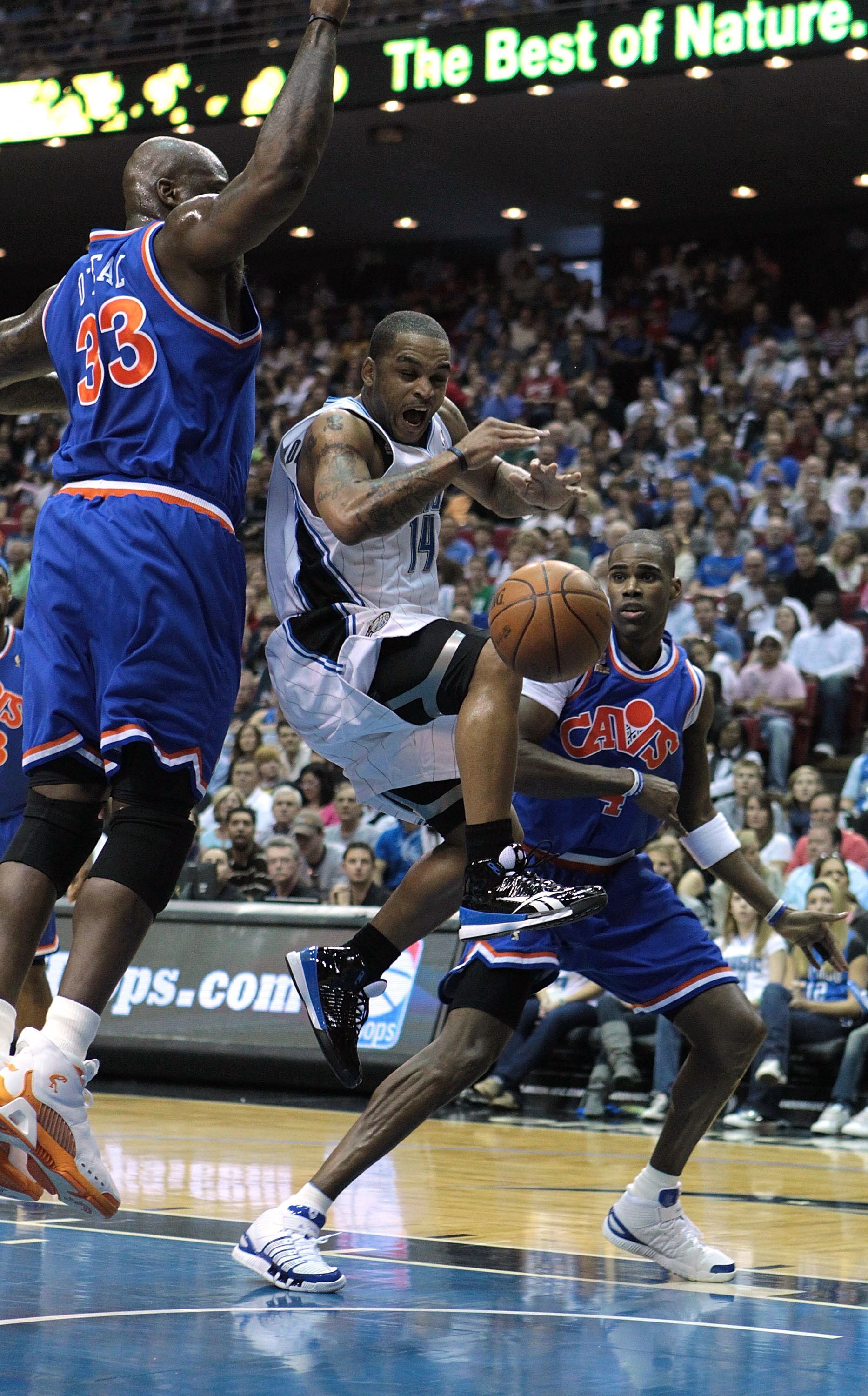 ORLANDO, FL - FEBRUARY 21:  Jameer Nelson #14 of the Orlando Magic attempts a shot against Shaquille O'Neal #33 of the Cleveland Cavaliers at Amway Arena on February 21, 2010 in Orlando, Florida. NOTE TO USER: User expressly acknowledges and agrees that,