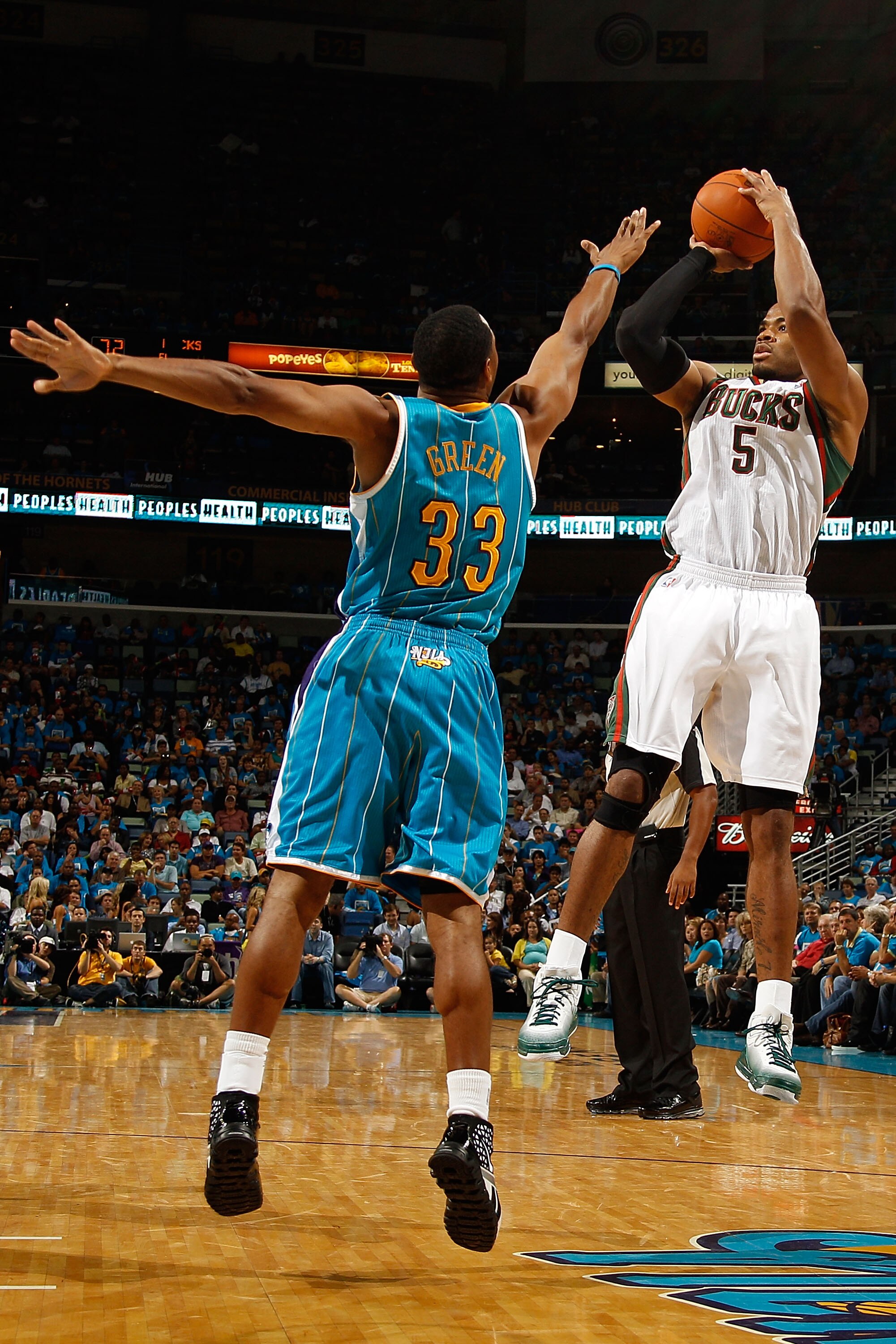 NEW ORLEANS - OCTOBER 27:  Corey Maggette #5  of the Milwaukee Bucks shoots the ball over Willie Green #33 of the New Orleans Hornets at the New Orleans Arena on October 27, 2010 in New Orleans, Louisiana.   The Hornets defeated the Bucks 95-91.   NOTE TO
