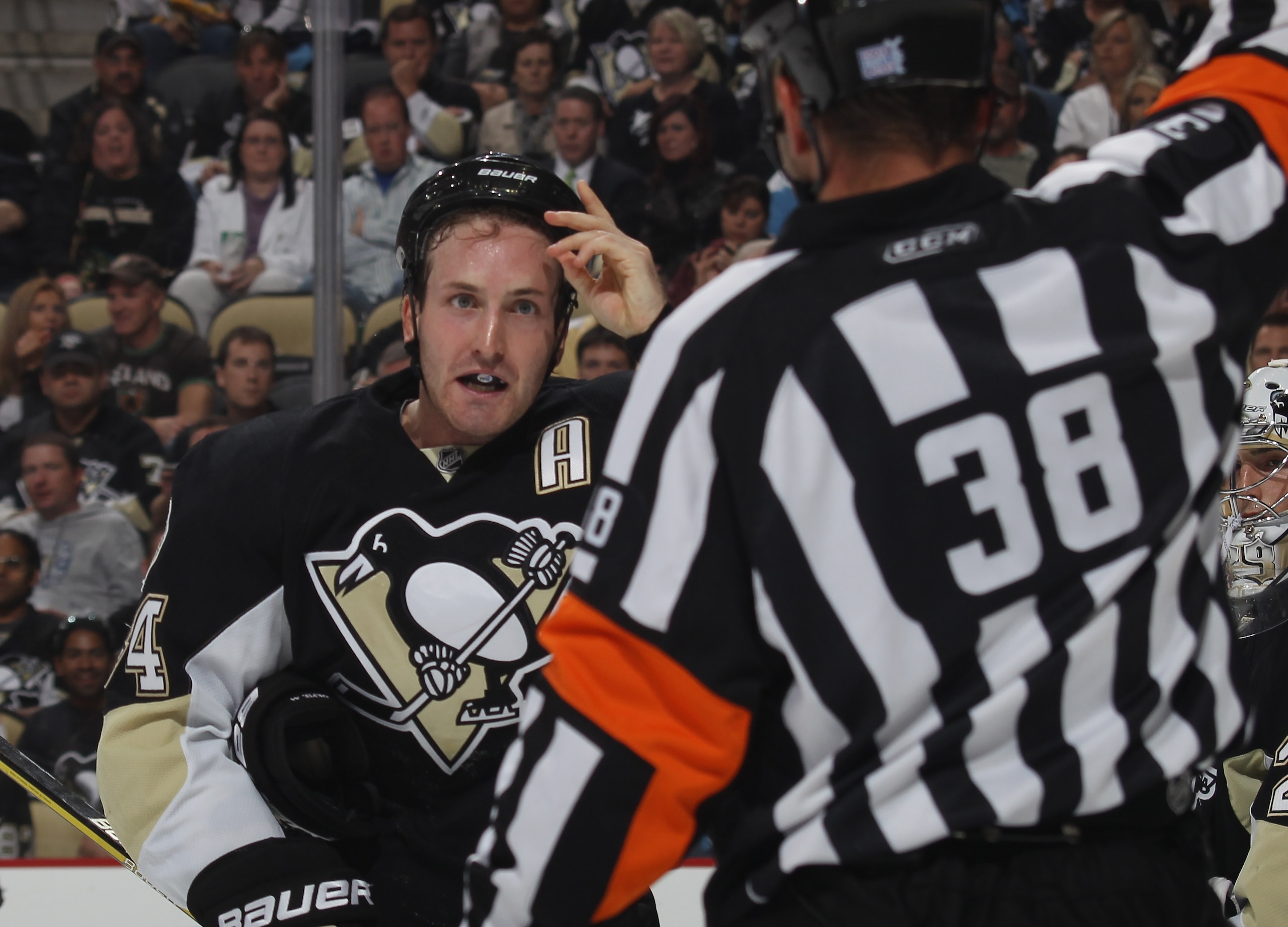 PITTSBURGH - OCTOBER 07: Brooks Orpik #44 of the Pittsburgh Penguins argues a penalty call by referee Francois St. Laurent #38 in his game against the Philadelphia Flyers at the Consol Energy Center on October 7, 2010 in Pittsburgh, Pennsylvania. (Photo PITTSBURGH - OCTOBER 07: Brooks Orpik #44 of the Pittsburgh Penguins argues a penalty call by referee Francois St. Laurent #38 in his game against the Philadelphia Flyers at the Consol Energy Center on October 7, 2010 in Pittsburgh, Pennsylvania. (Photo