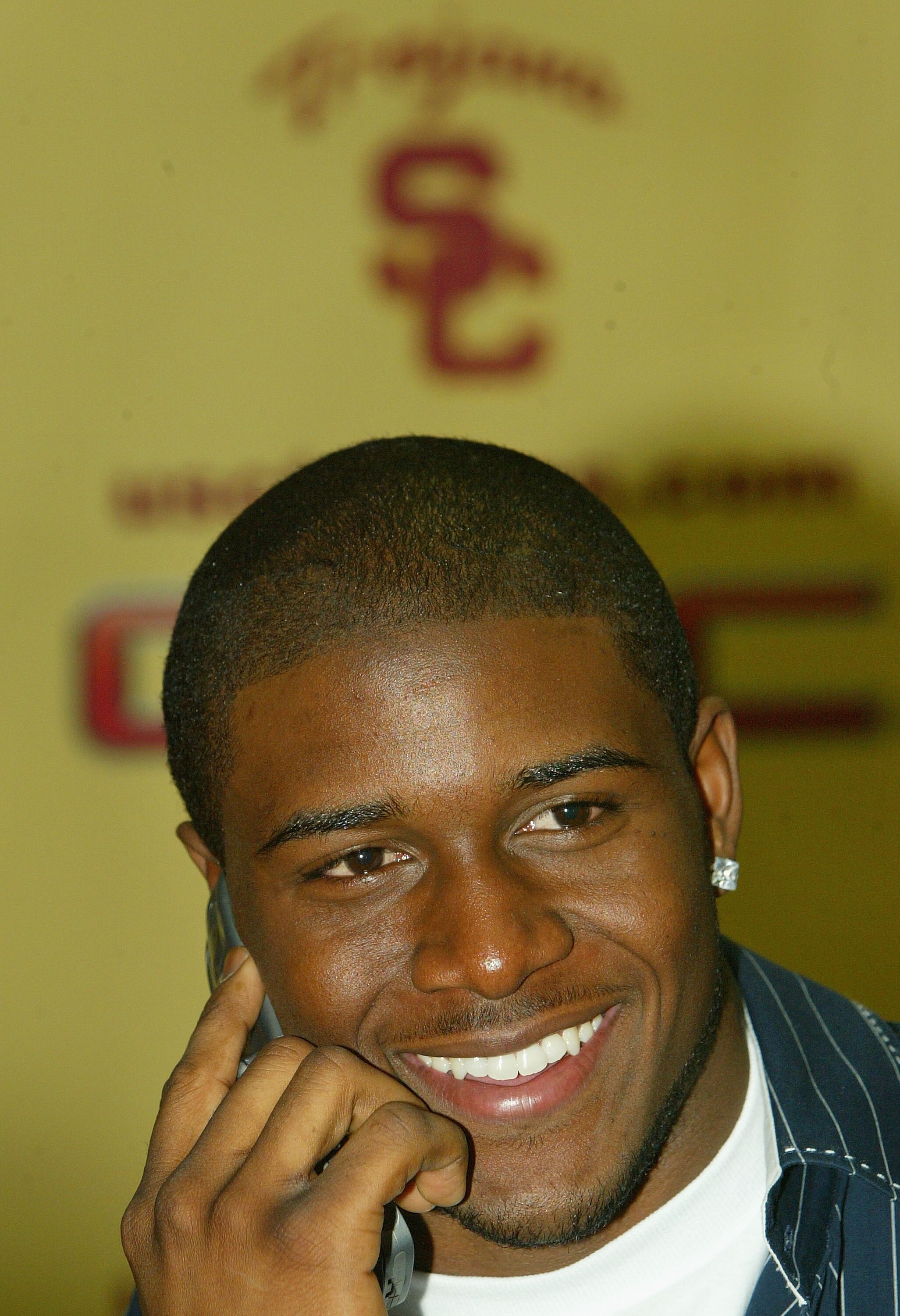 LOS ANGELES, CA - JANUARY 12:  Reggie Bush of the USC Trojans smiles as he announces that he will forgo his senior year and enter the 2006 NFL Draft during a press conference on January 12, 2006 at Heritage Hall on the USC Campus in Los Angeles, Californi