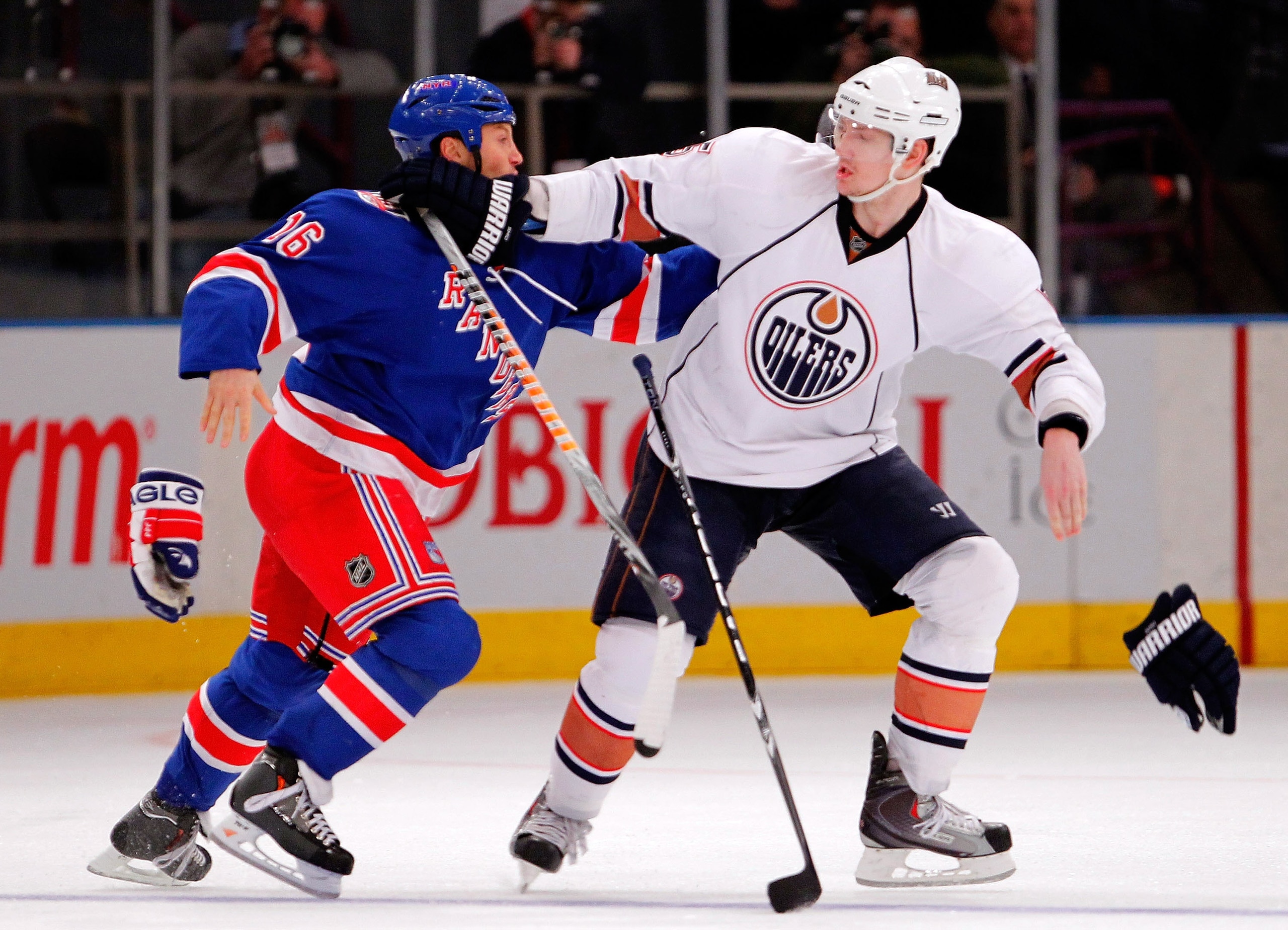 NEW YORK - NOVEMBER 14: Sean Avery #16 of the New York Rangers throws his gloves and starts to fight with Ladislav Smid #5 of the Edmonton Oilers after they had words during the third period of a hockey game at Madison Square Garden on November 14, 2010 NEW YORK - NOVEMBER 14: Sean Avery #16 of the New York Rangers throws his gloves and starts to fight with Ladislav Smid #5 of the Edmonton Oilers after they had words during the third period of a hockey game at Madison Square Garden on November 14, 2010
