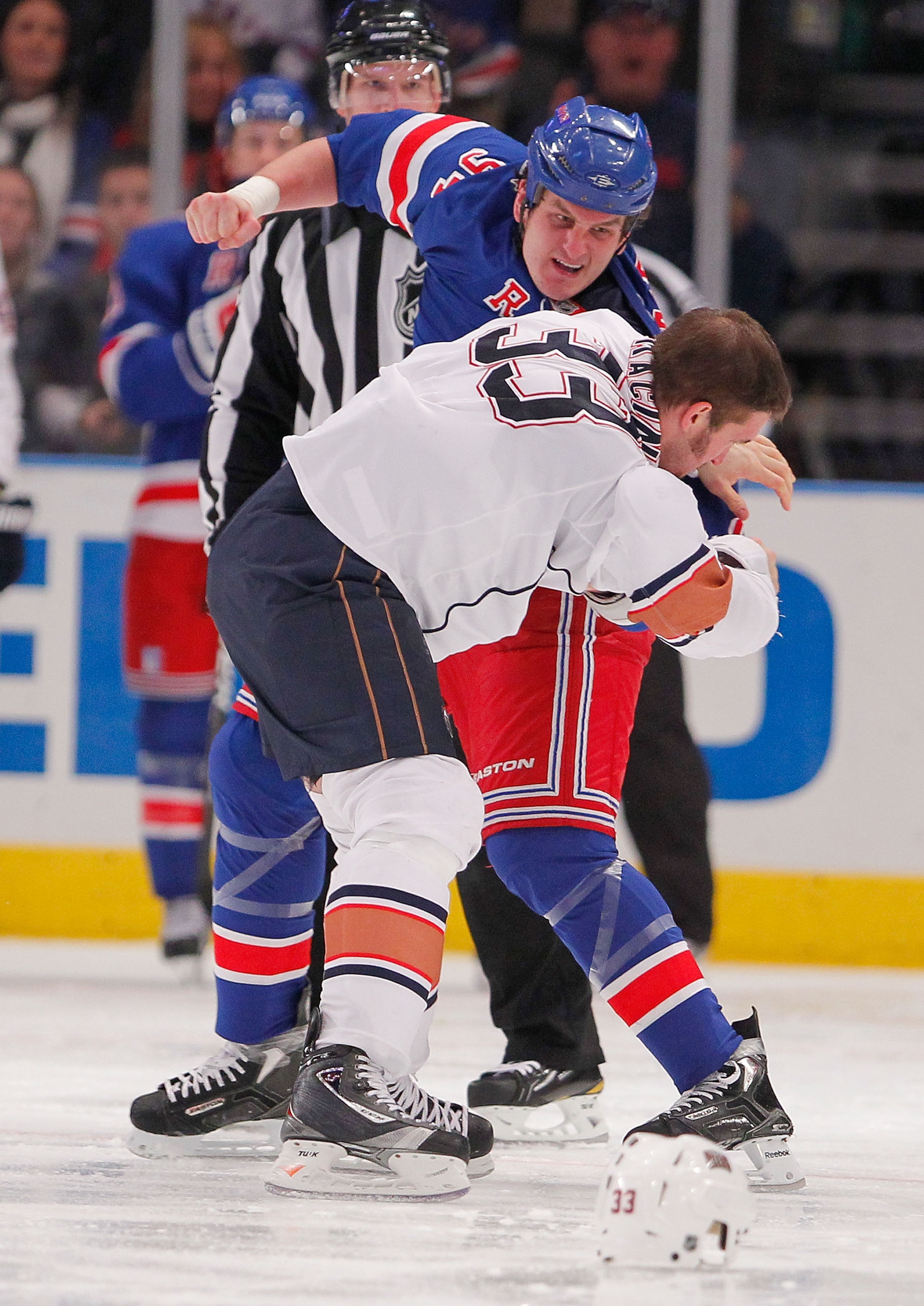 NEW YORK - NOVEMBER 14: Steve MacIntyre #33 of the Edmonton Oilers fighting with Derek Boogaard #94 of the New York Rangers during a hockey game at Madison Square Garden on November 14, 2010 in New York City. (Photo by Paul Bereswill/Getty Images) NEW YORK - NOVEMBER 14: Steve MacIntyre #33 of the Edmonton Oilers fighting with Derek Boogaard #94 of the New York Rangers during a hockey game at Madison Square Garden on November 14, 2010 in New York City. (Photo by Paul Bereswill/Getty Images)