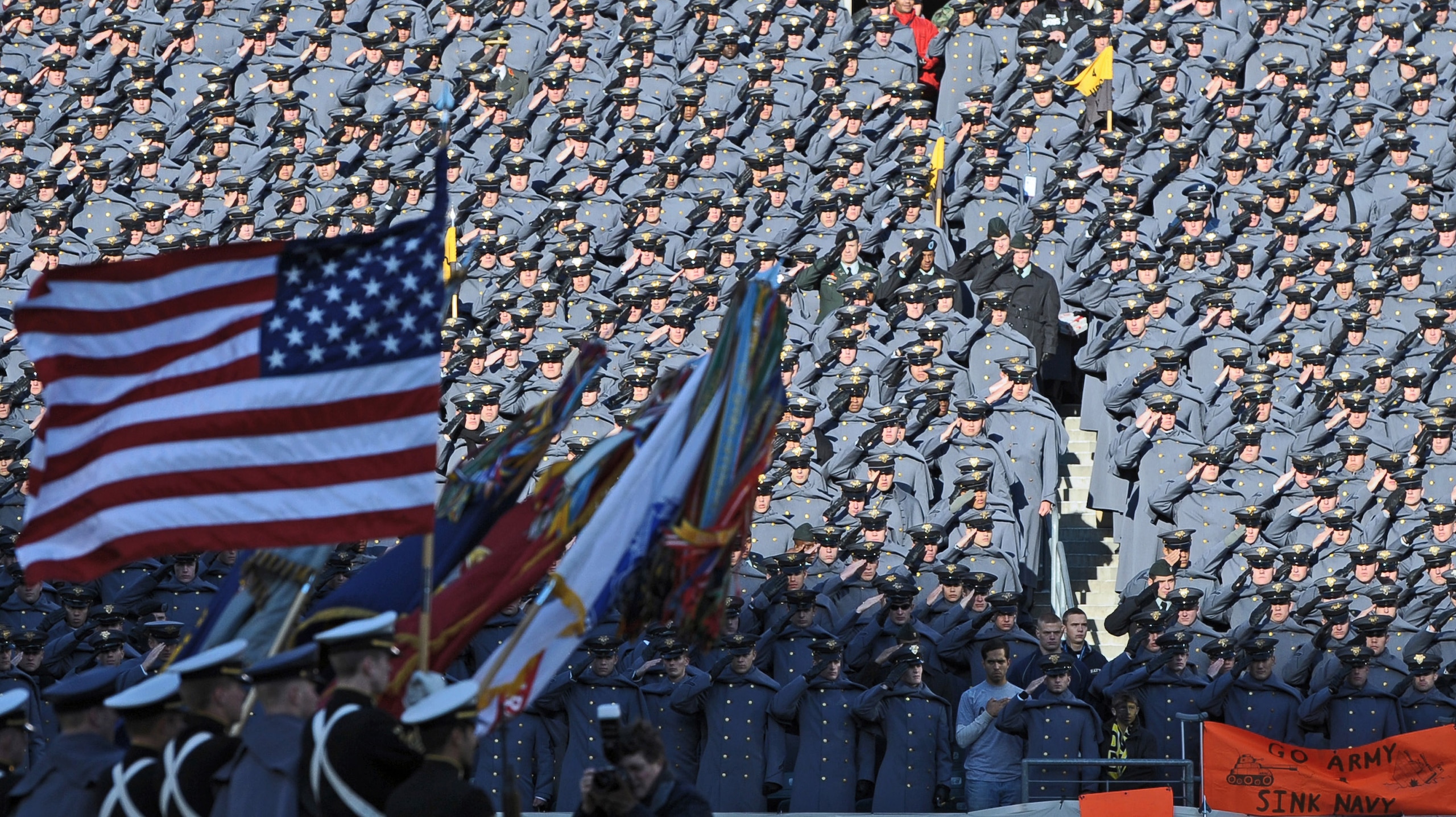 PHILADELPHIA - DECEMBER 12:  Army Cadets salute the American Flag during the National Anthem before the game against the Navy Midshipmen on December 12, 2009 at Lincoln Financial Field in Philadelphia, Pennsylvania. (Photo by Drew Hallowell/Getty Images)