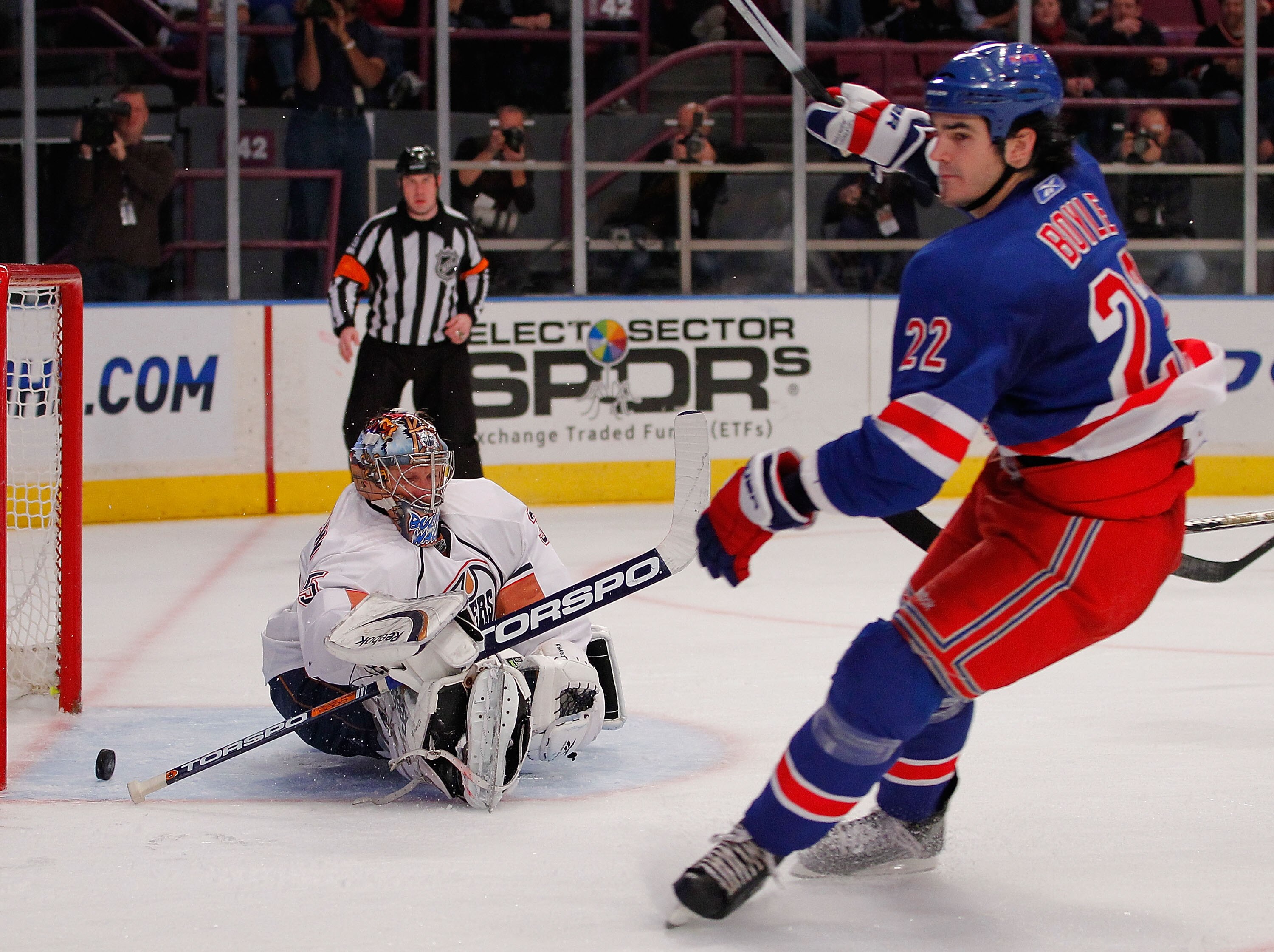 NEW YORK - NOVEMBER 14:  Goalie Nikolai Khabibulin #35 of the Edmonton Oilers sits on the ice as the puck comes out of the net on a goal by Brian Boyle #22 of the New York Rangers during the second period of a hockey game at Madison Square Garden on Novem