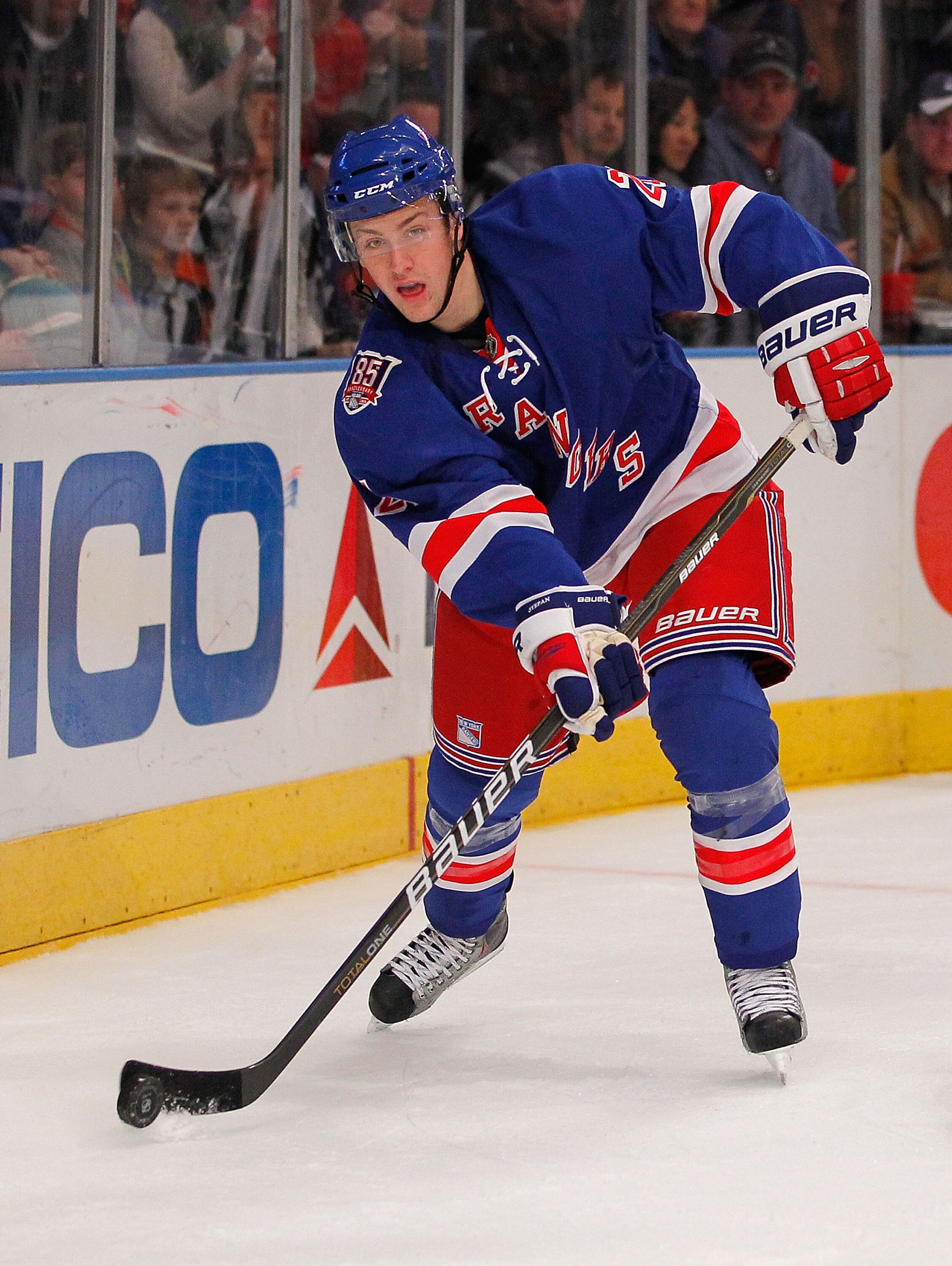 NEW YORK - NOVEMBER 14:  Derek Stepan #21 of the New York Rangers passes the puck during a hockey game against the Edmonton Oilers at Madison Square Garden on November 14, 2010 in New York City.  (Photo by Paul Bereswill/Getty Images)