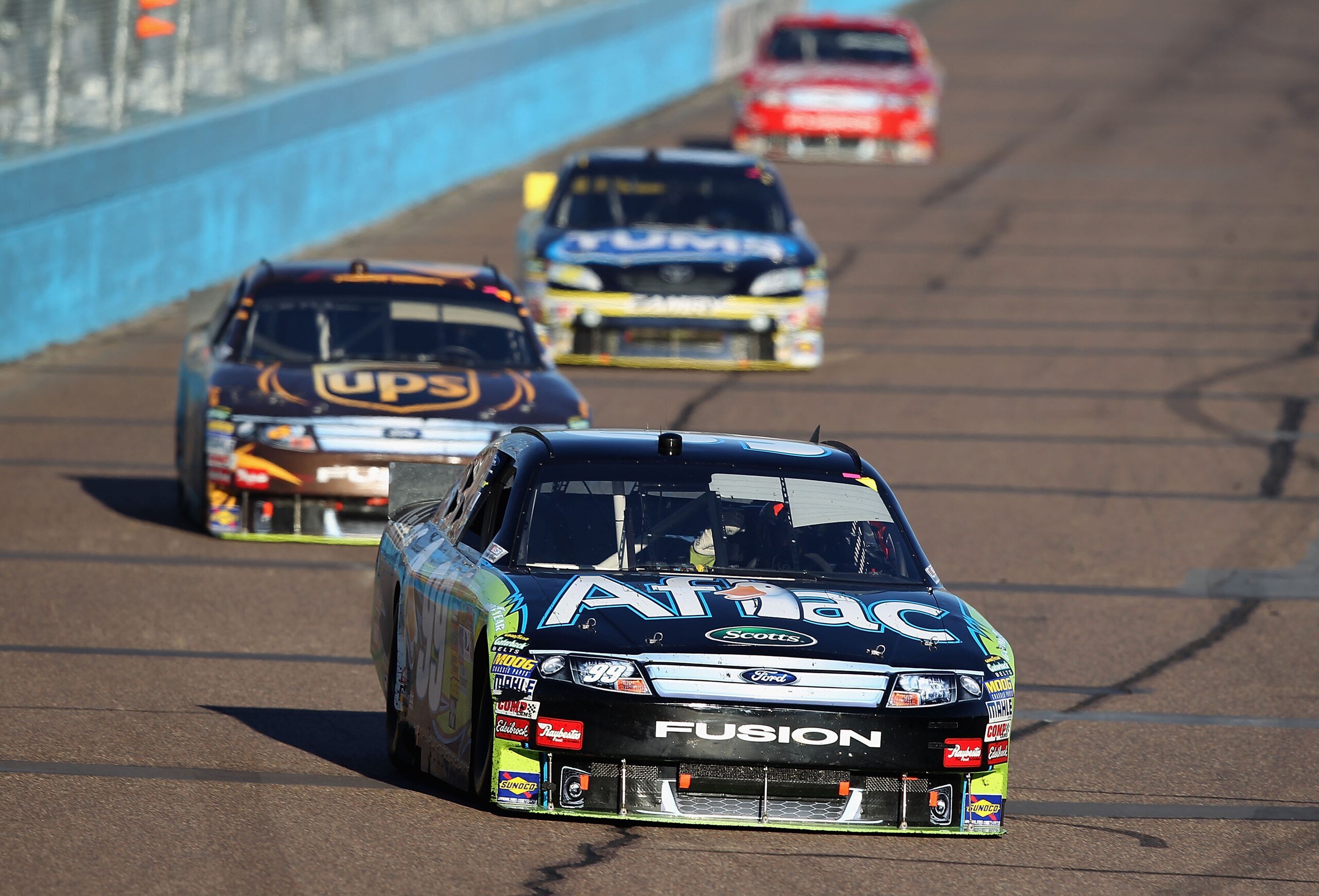 AVONDALE, AZ - NOVEMBER 14:  Carl Edwards, driver of the #99 Aflac Ford, drives during the NASCAR Sprint Cup Series Kobalt Tools 500 at Phoenix International Raceway on November 14, 2010 in Avondale, Arizona.  (Photo by Christian Petersen/Getty Images for