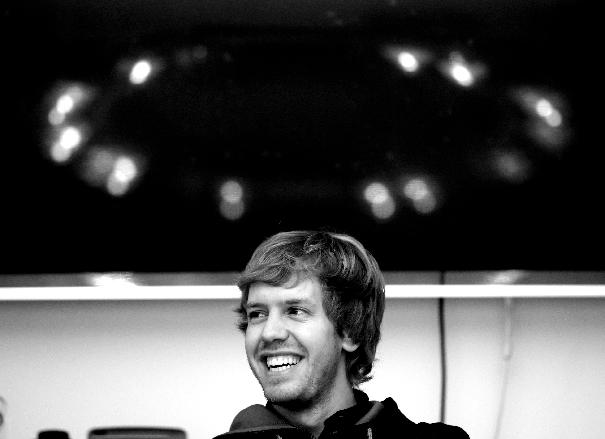 MILTON KEYNES, ENGLAND - NOVEMBER 16:  New Formula 1 World Champion Red Bull racing driver  Sebastian Vettel talking to the media at the teams headquaters in Milton Keynes on November 16, 2010 in Milton Keynes, England.  (Photo by Mark Thompson/Getty Imag