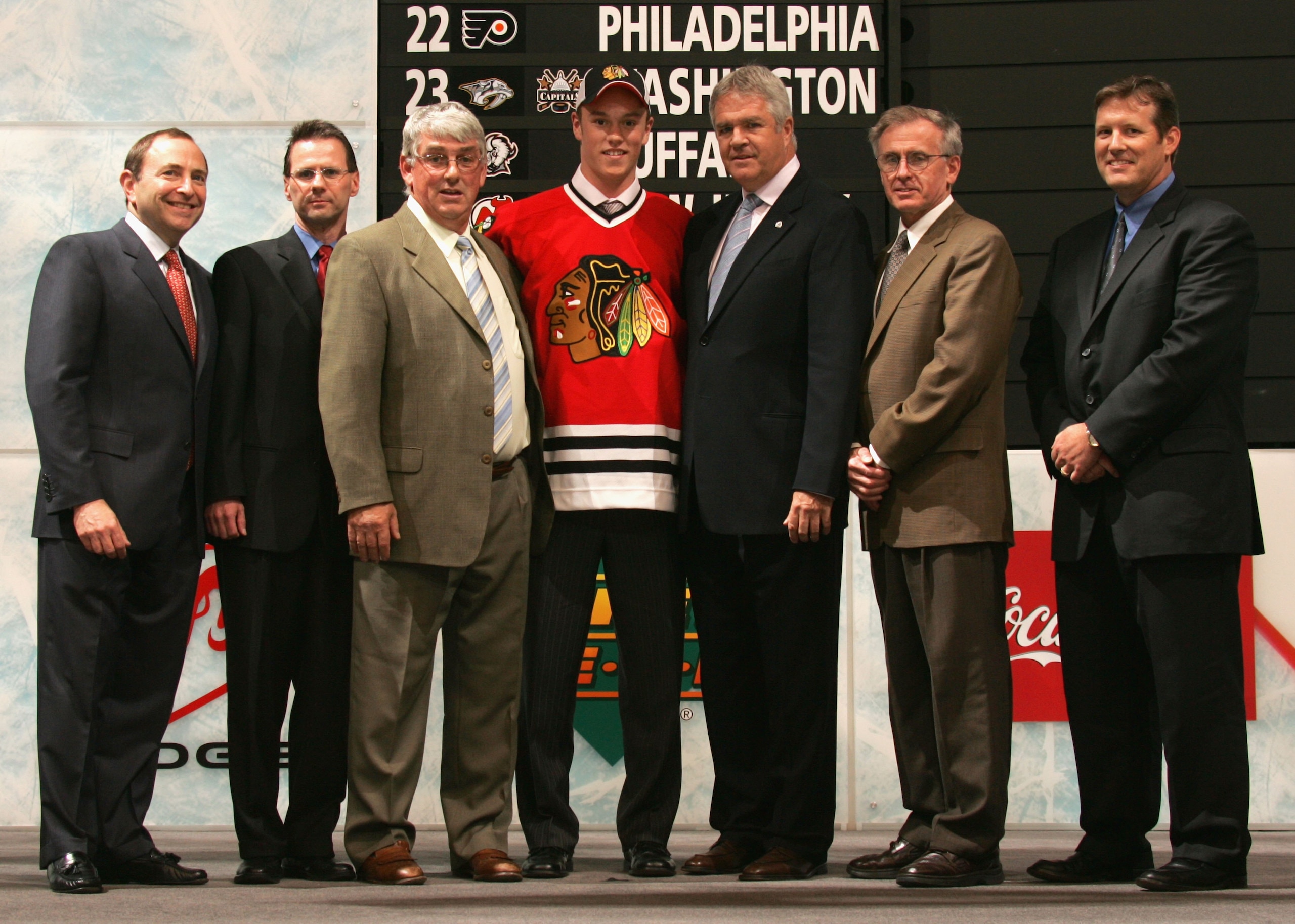VANCOUVER, BC - JUNE 24:  3rd overall pick Jonathan Toews of the Chicago Blackhawks poses on stage with team personnel and NHL Commissioner Gary Bettman (L) during the 2006 NHL Draft held at General Motors Place on June 24, 2006 in Vancouver, Canada.  (Ph