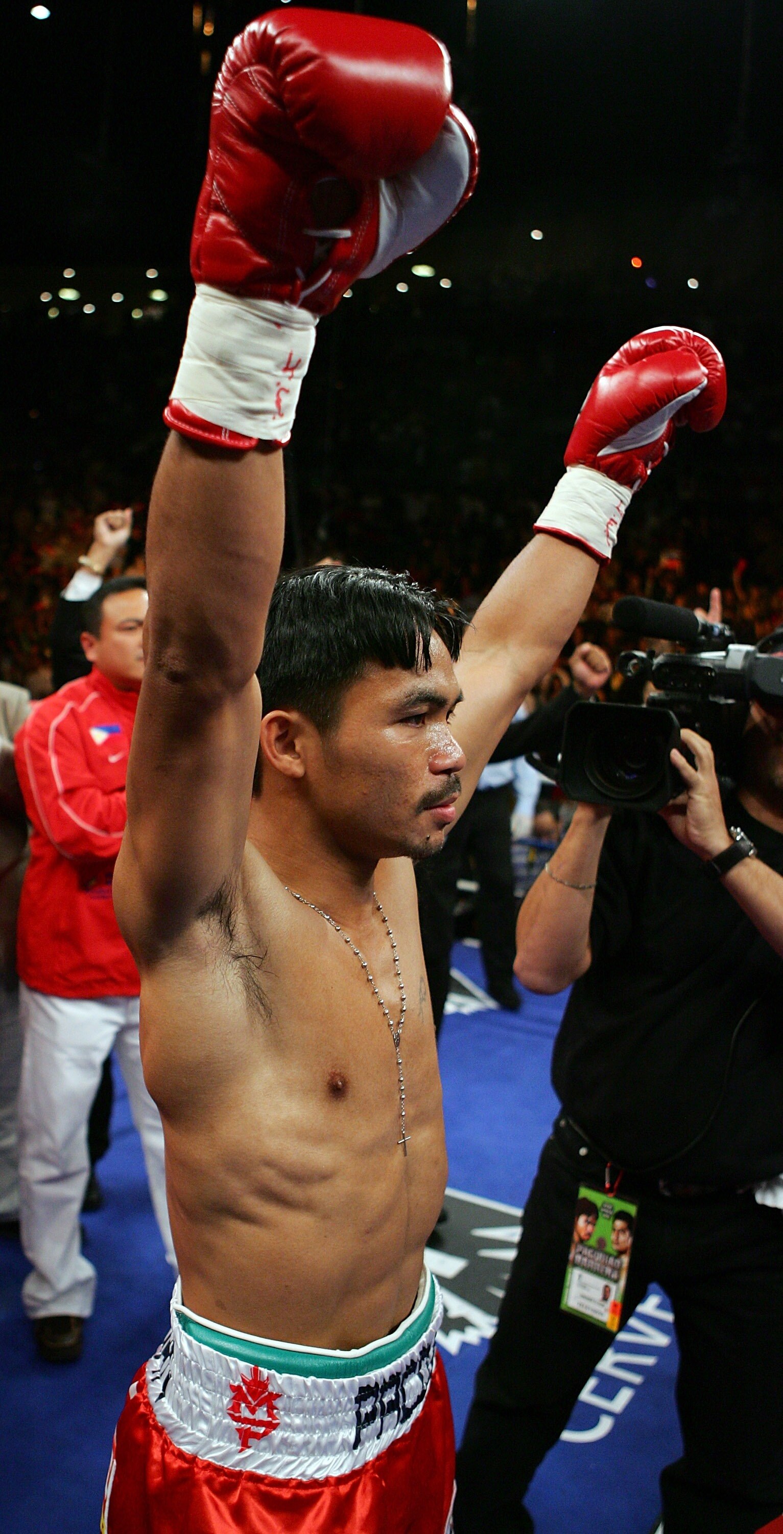 LAS VEGAS - OCTOBER 06:  Manny Pacquiao raises his arms before his 12-round super featherweight bout with Marco Antonio Barrera at the Mandalay Bay Events Center October 6, 2007 in Las Vegas, Nevada. Pacquiao won by unanimous decision.  (Photo by Ethan Mi