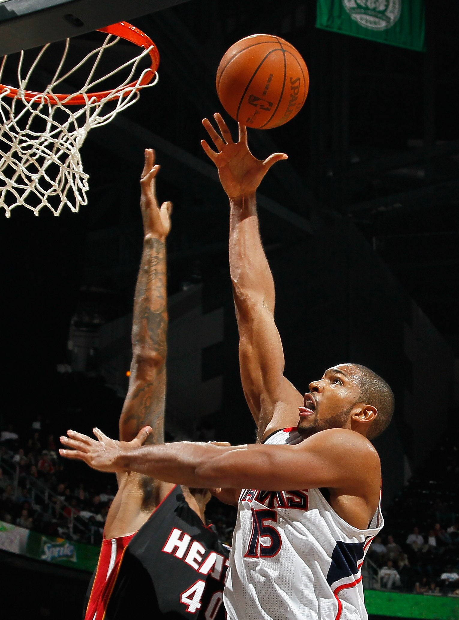 ATLANTA - OCTOBER 21:  Al Horford #15 of the Atlanta Hawks drives the lane against Udonis Haslem #40 of the Miami Heat at Philips Arena on October 21, 2010 in Atlanta, Georgia.  (Photo by Kevin C. Cox/Getty Images)